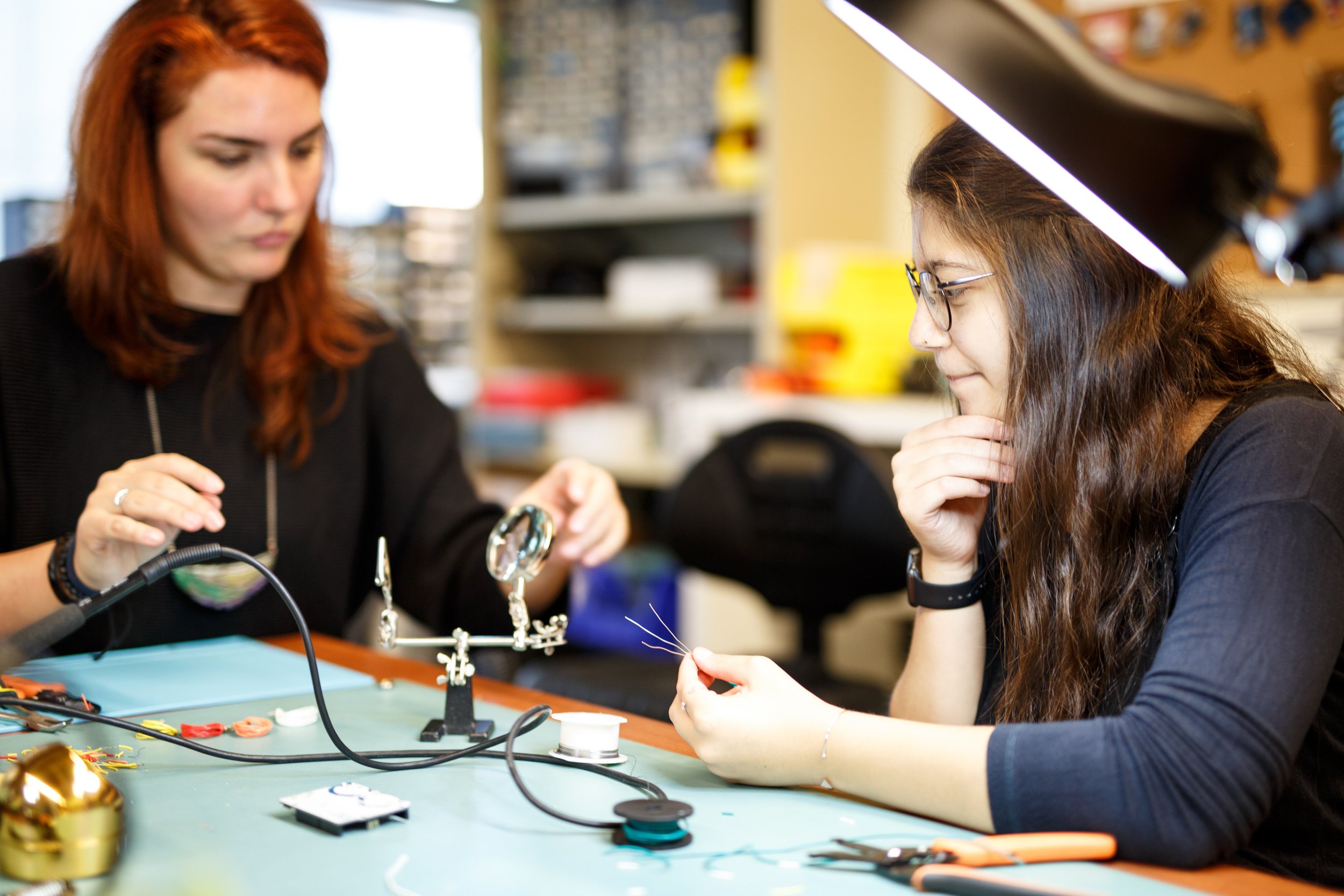 2 Researchers working with a soldering kit