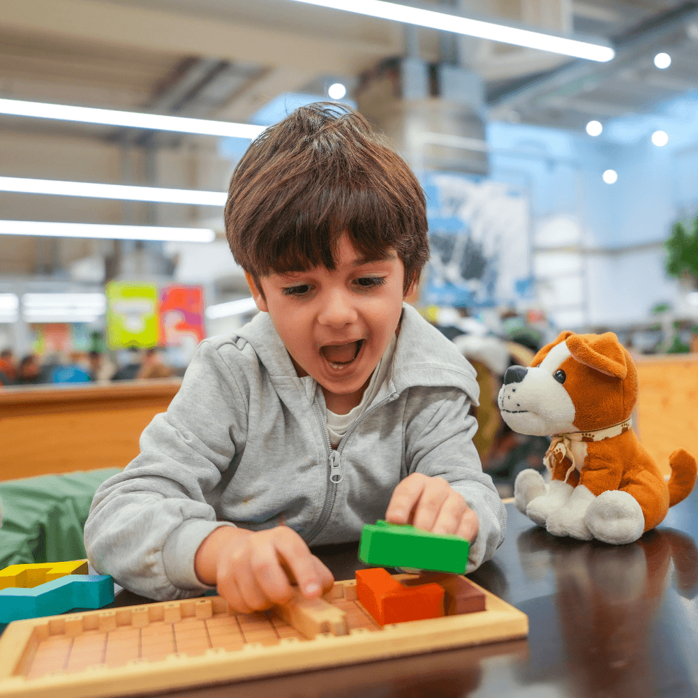 Boy working with puzzle in occupational therapy