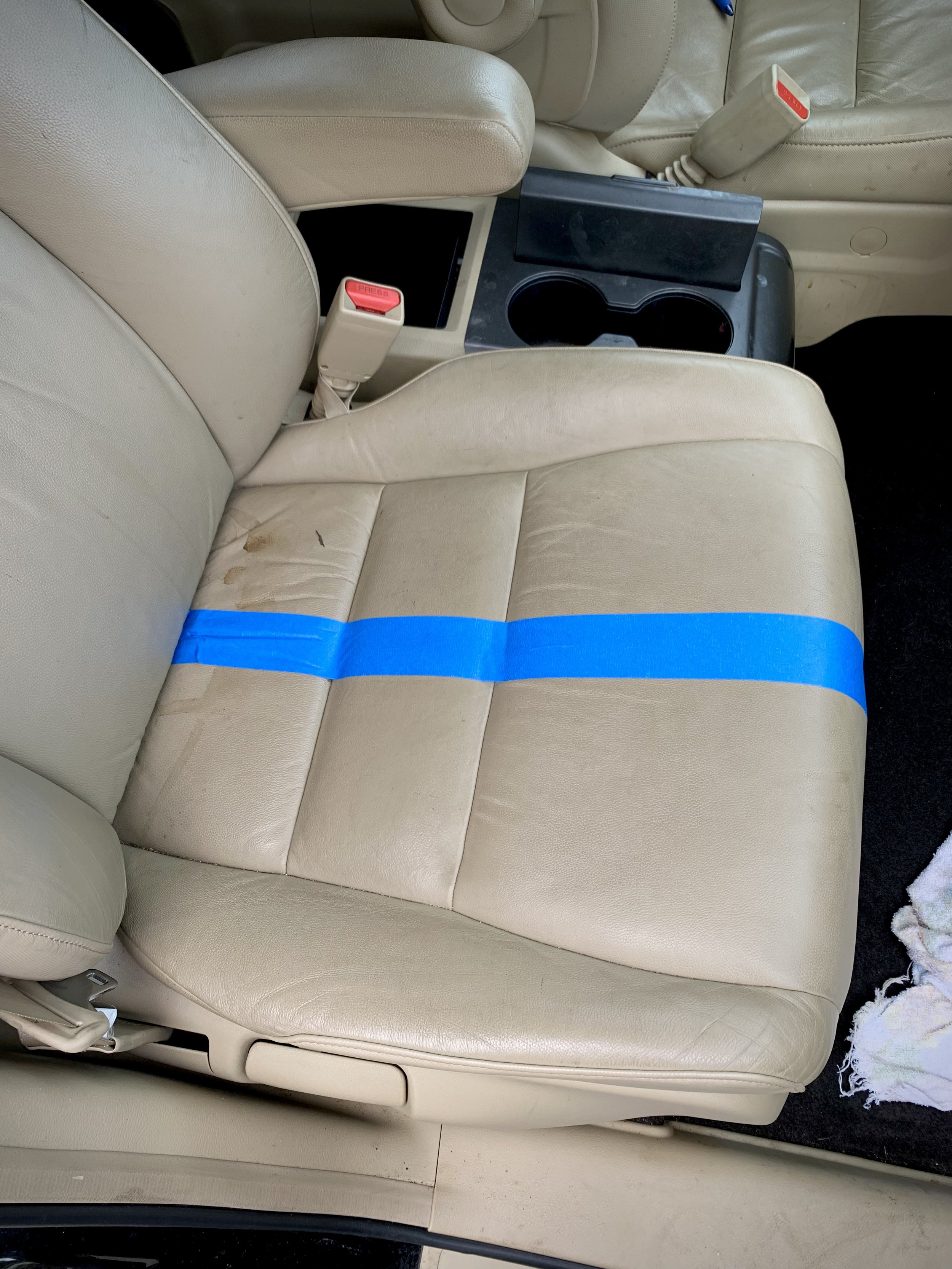 Leather seat cleaning 50/50 (cleaning half, leaving other half as is).