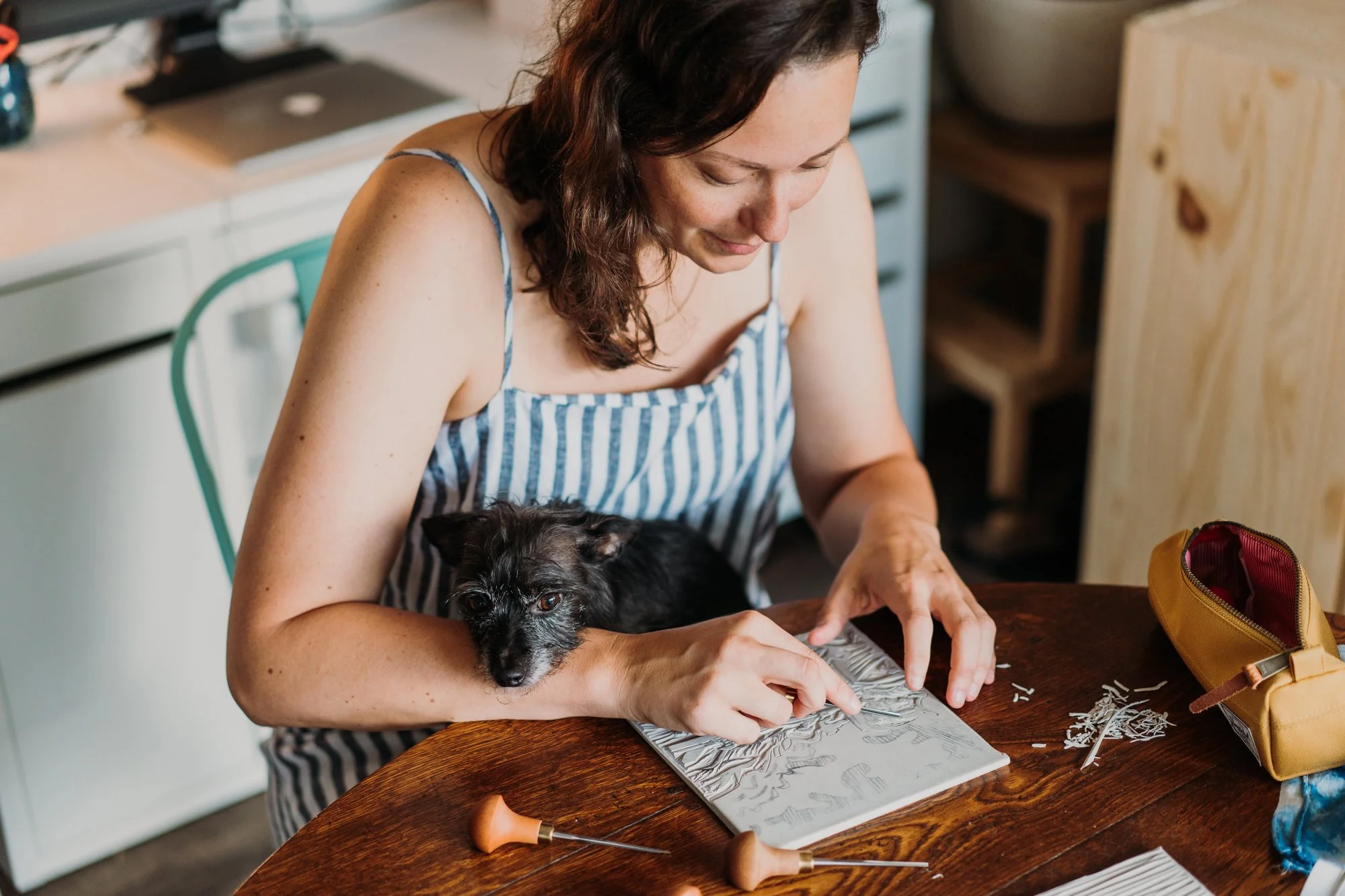 Ellen Orchard carving a linocut