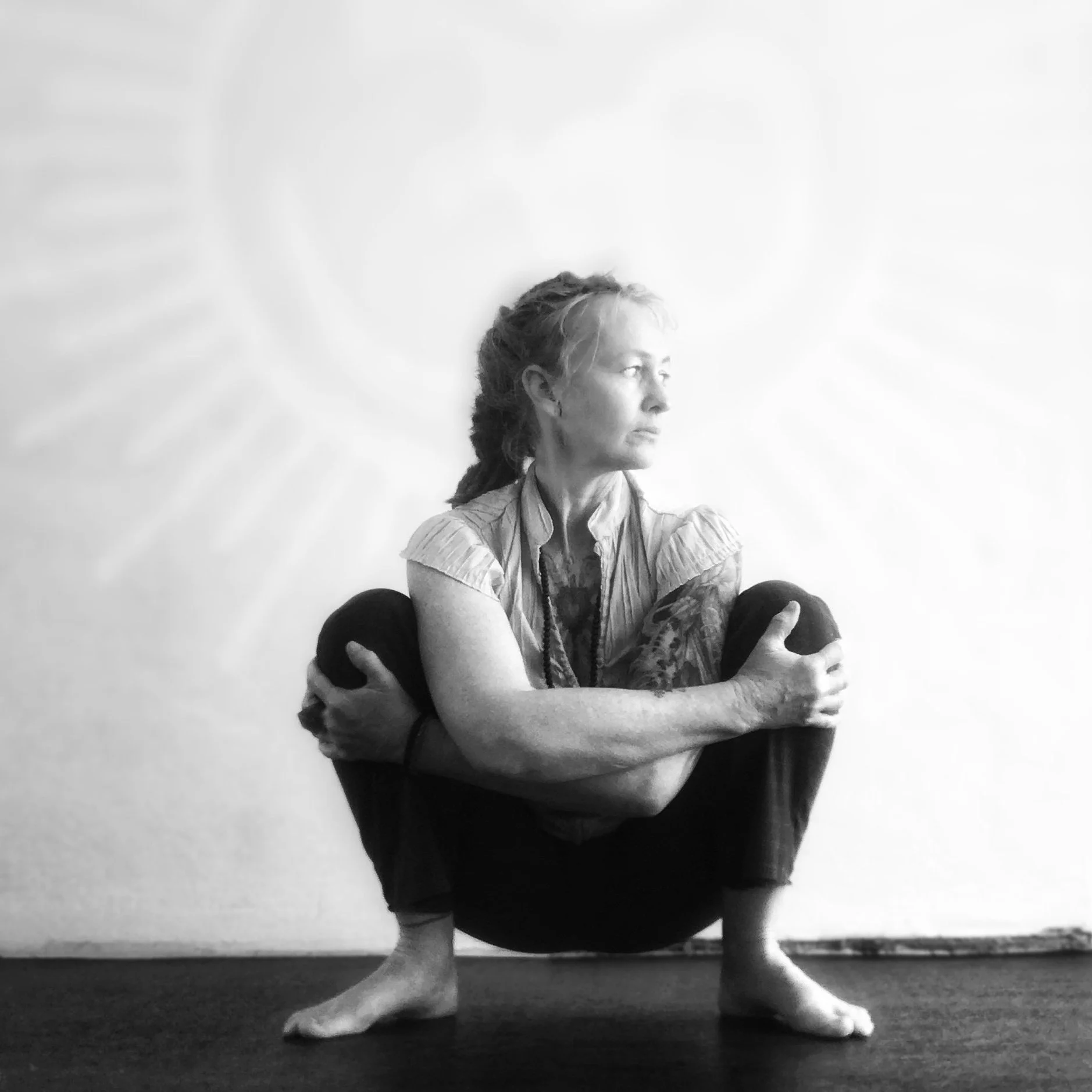Yoga teacher Yolande Hyde seated in practice, teacher of Traditional Yoga, Japanese Yoga and Five Element seasonal practice on the NSW South Coast.