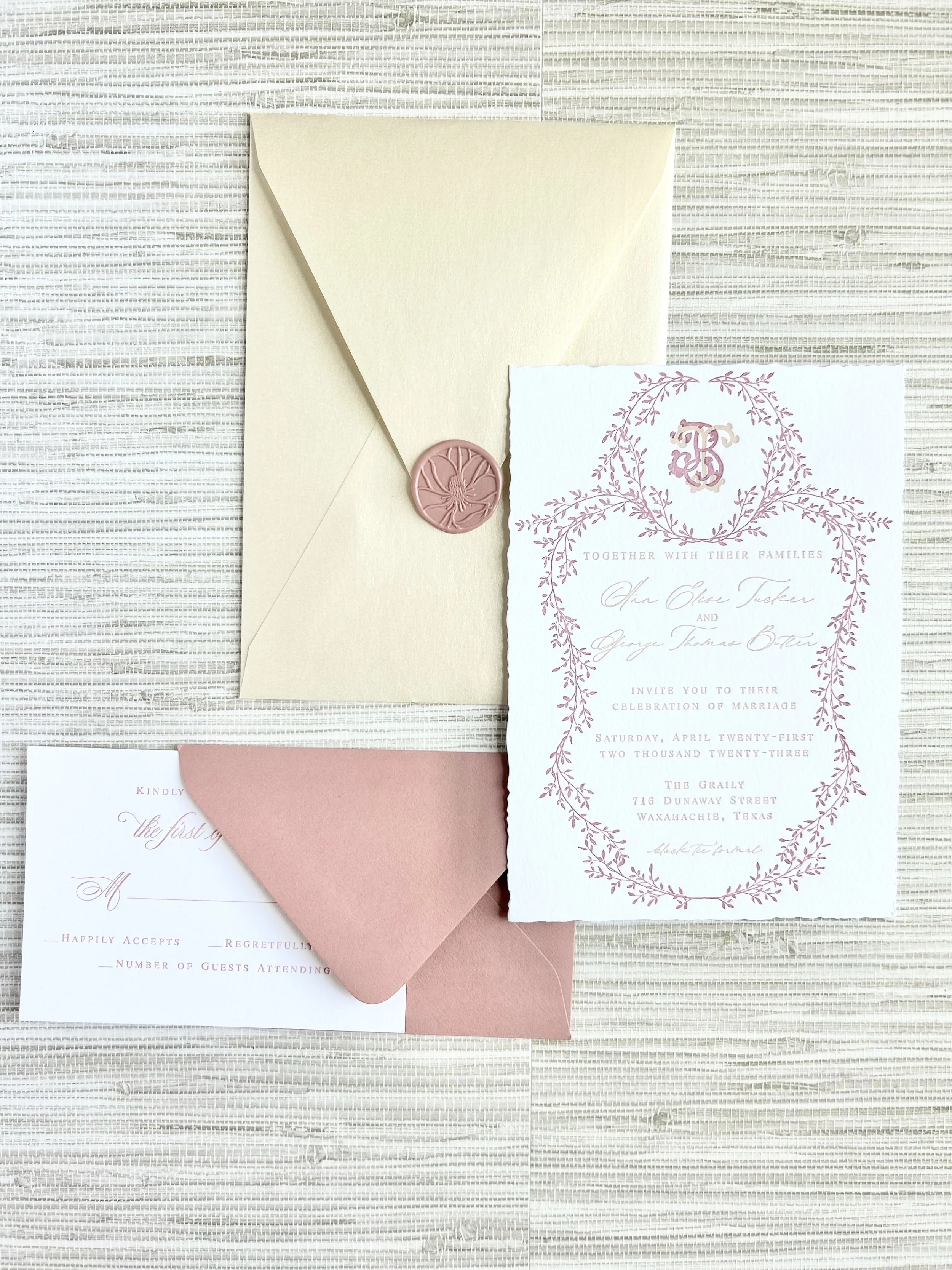 The Graily Invitation Suite with fine-art envelope liner, dusty rose envelopes, hand torn paper invitation card with custom monogram. Vintage postage makes this suite even sweeter!