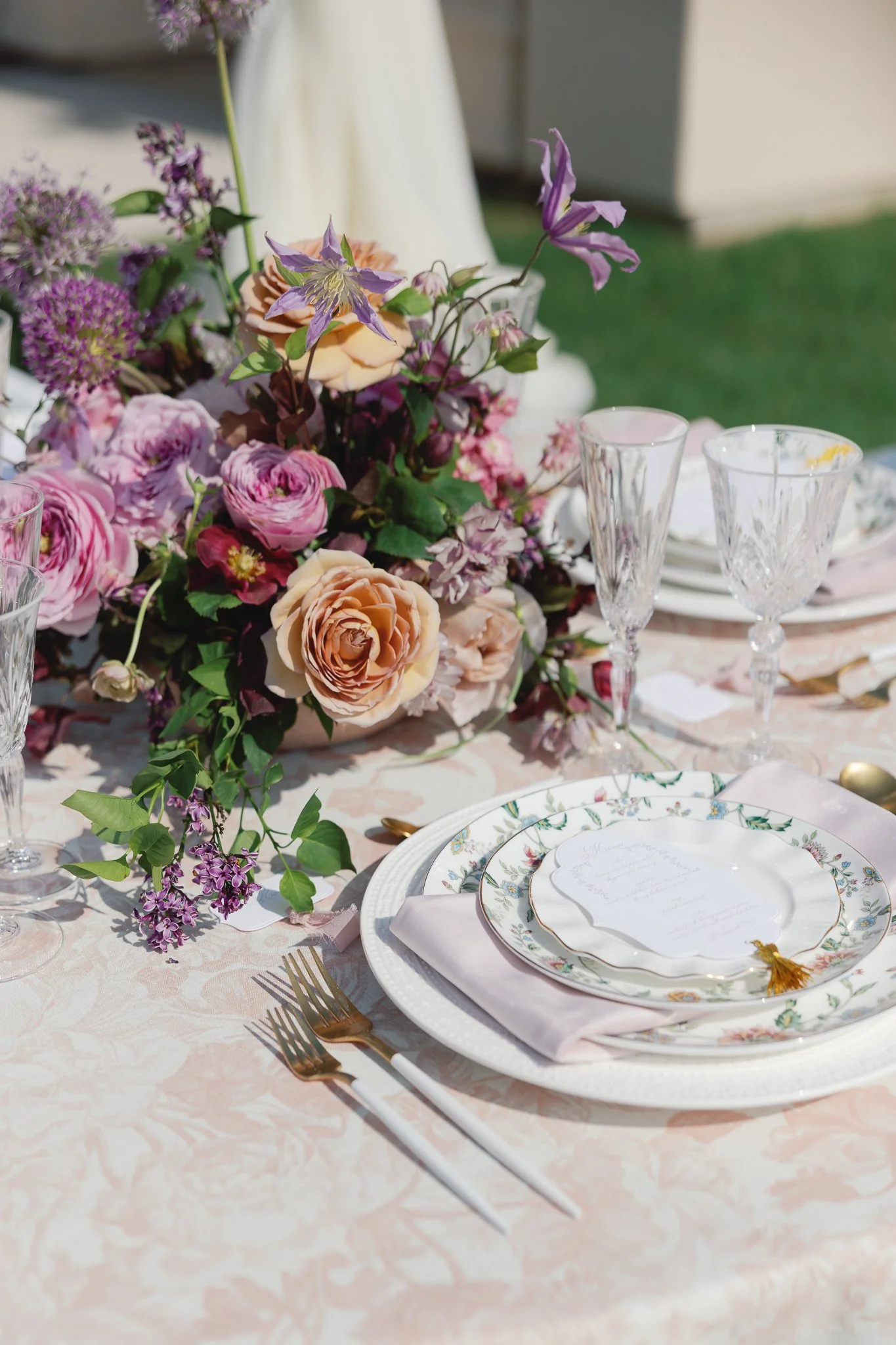 spring lavender wedding stationery table scape with unique menu card shape with gold tassel