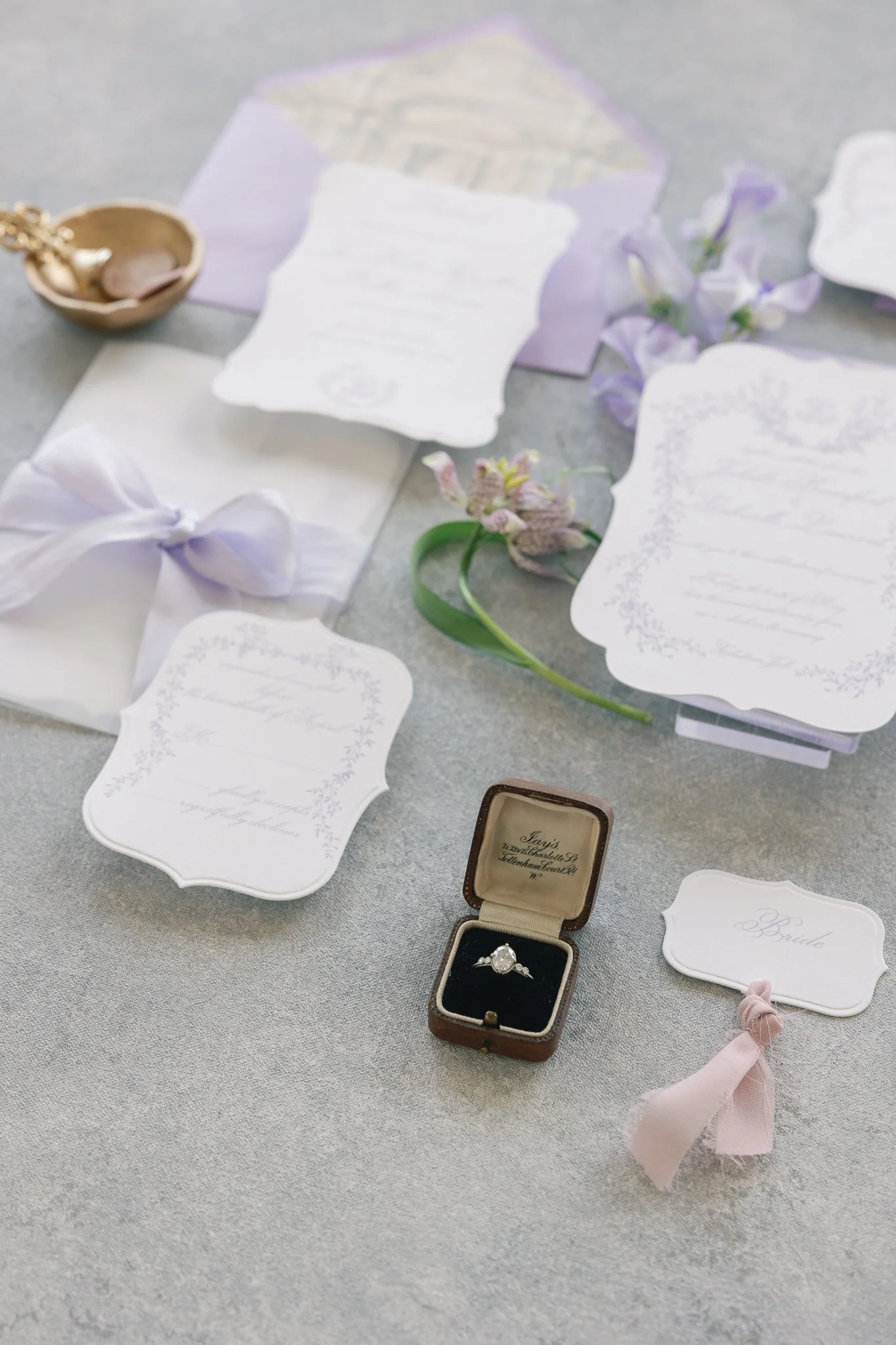 Dior luxury wedding invitations, lavender letterpress with vintage architecture envelope liner, menu with unique shape details card and gold tassels