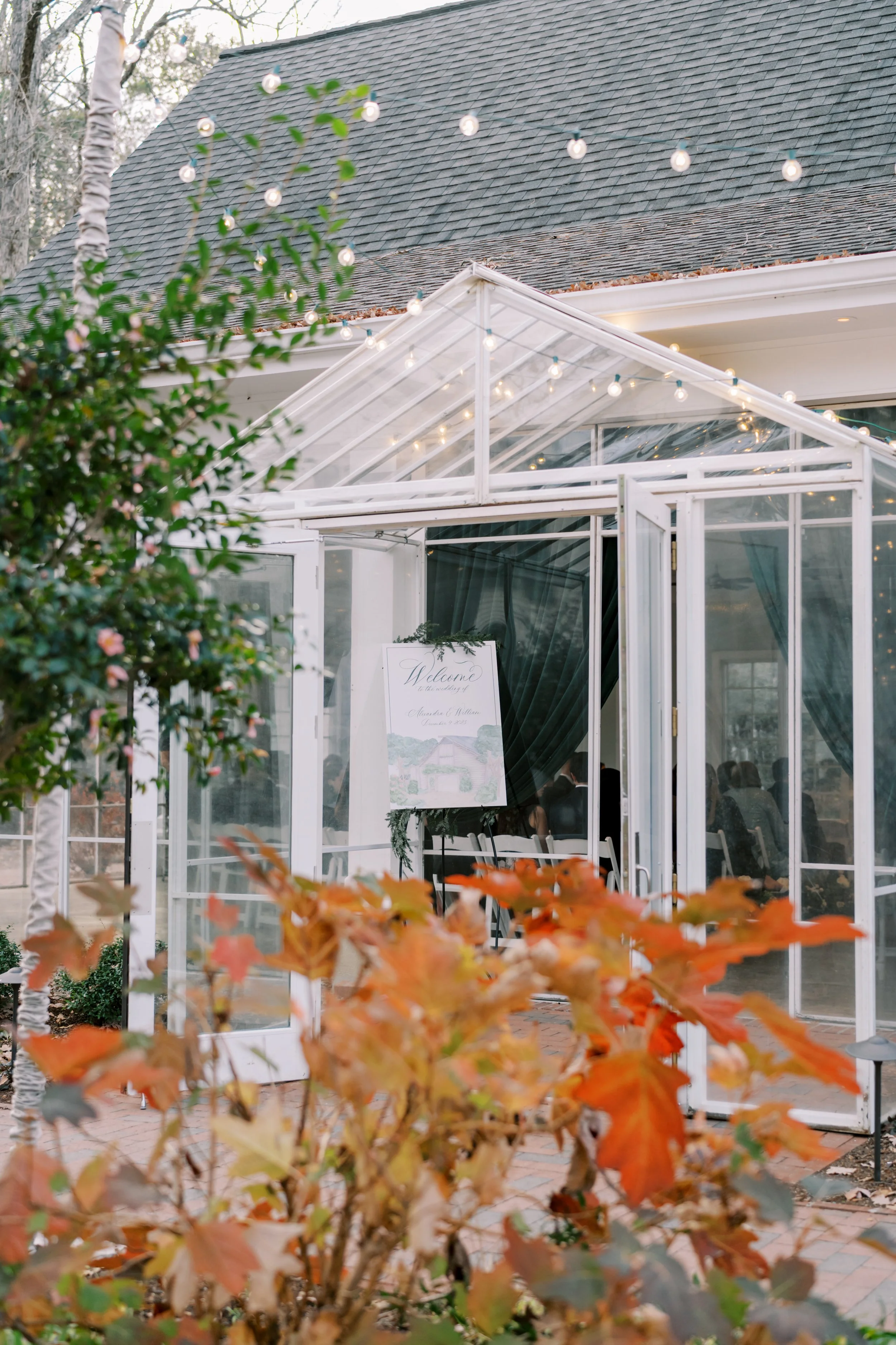 Watercolor venue painting welcome sign for winter wedding reception at Fearrington Inn in North Carolina