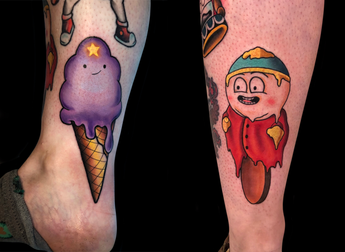 Tattoo of a purple ice cream cone with a smiling face and a star on top, on the left leg. Tattoo of a cartoon character in a red hoodie with a scoop of ice cream on their head, on the right leg.