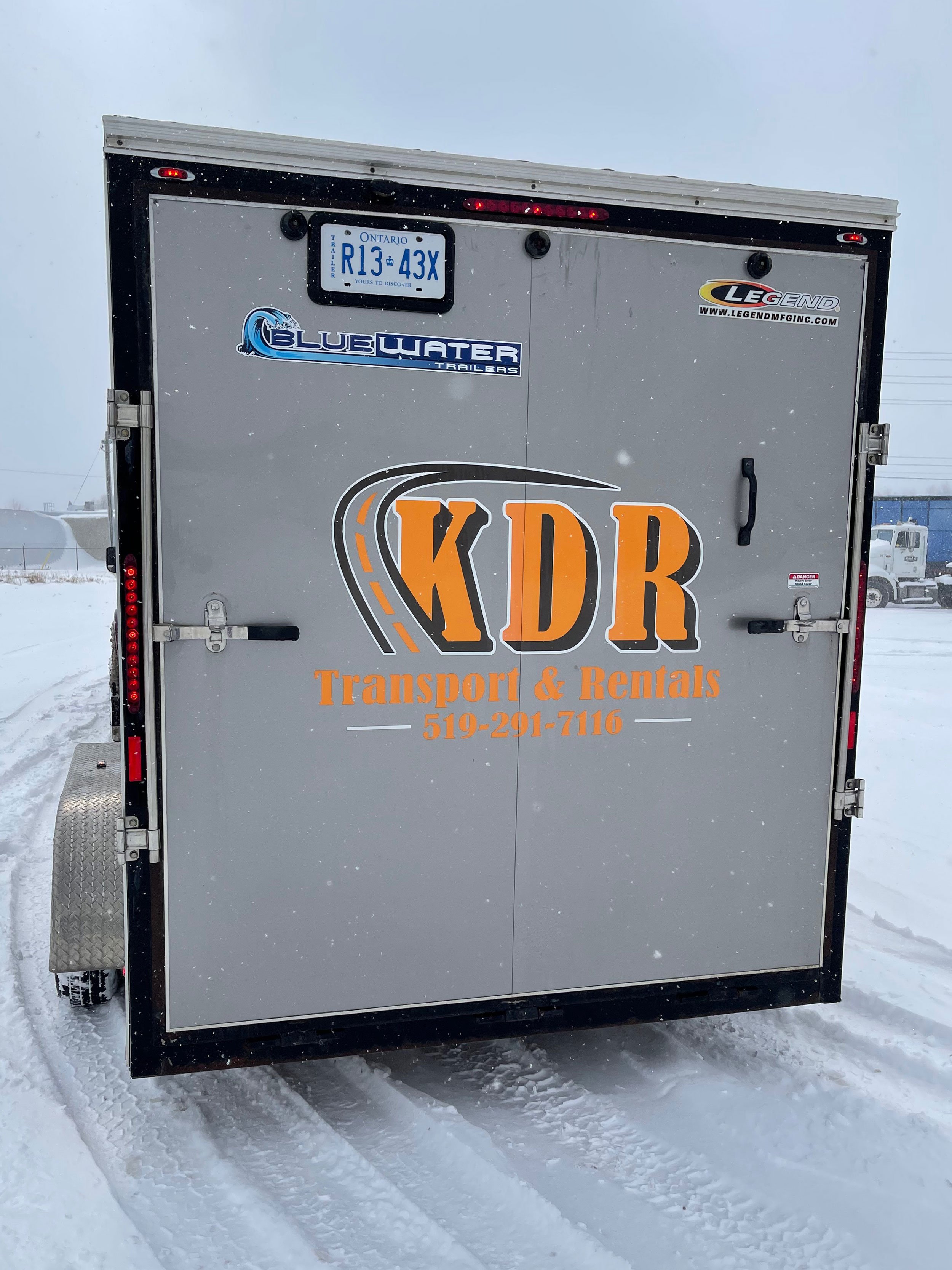 back-tandem-axel-7x16-v-nose-enclosed-trailer-rental-KDR-Rentals-Transport.jpg