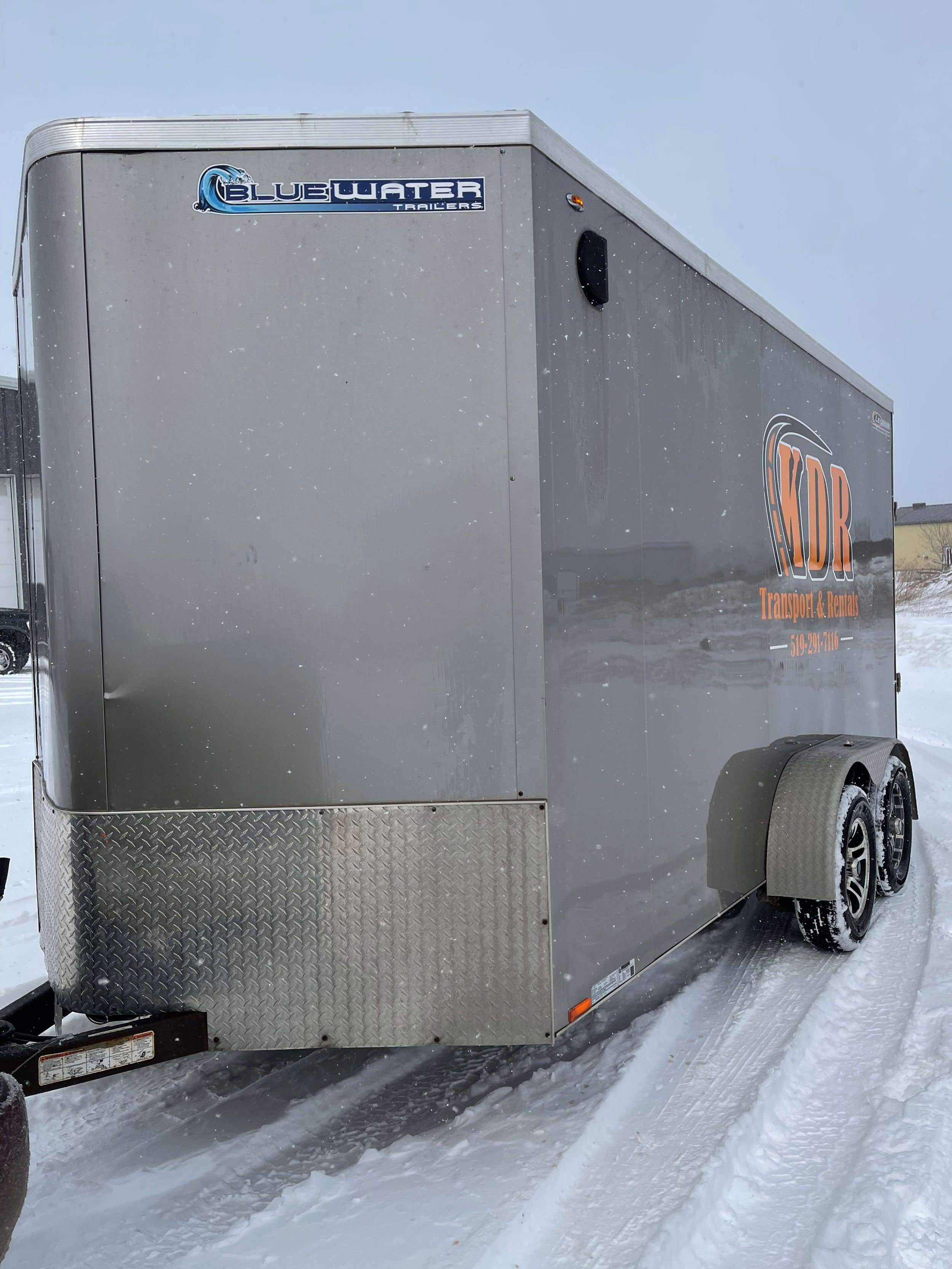 side-tandem-axel-7x16-v-nose-enclosed-trailer-rental-KDR-Rentals-Transport.jpg