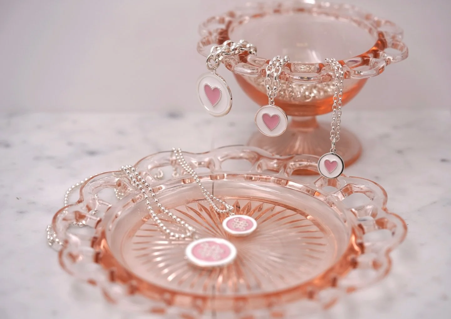 New Flamingo Pink enamel adds a soft, expressive pop to your Valentine&rsquo;s Day styling! It&rsquo;s now available in the Heart and Mother &amp; Daughter pendants, celebrating love and connection in a fresh, empowering way - perfect for layering or