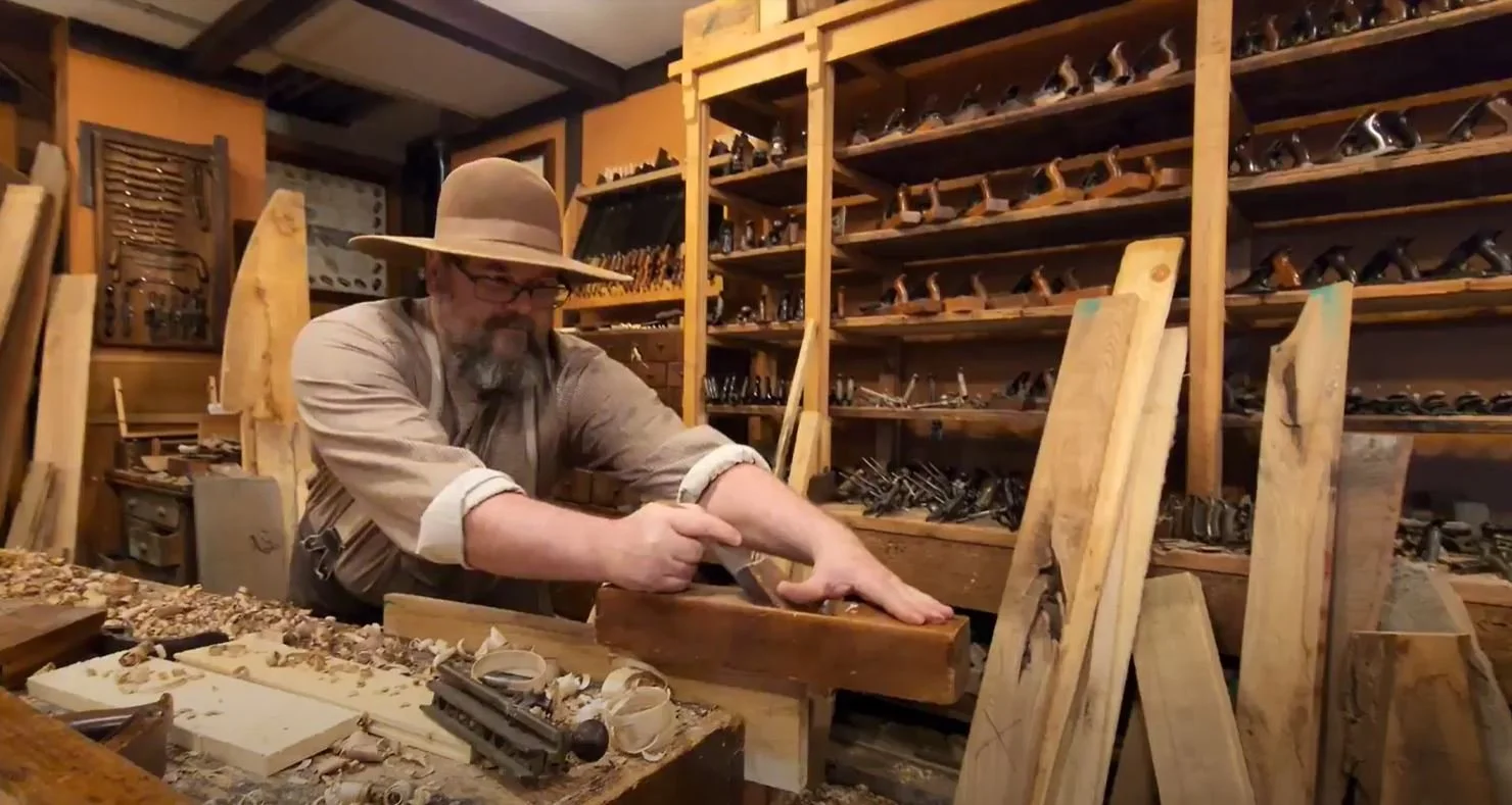 Attractions Man Shaving Wood.JPG