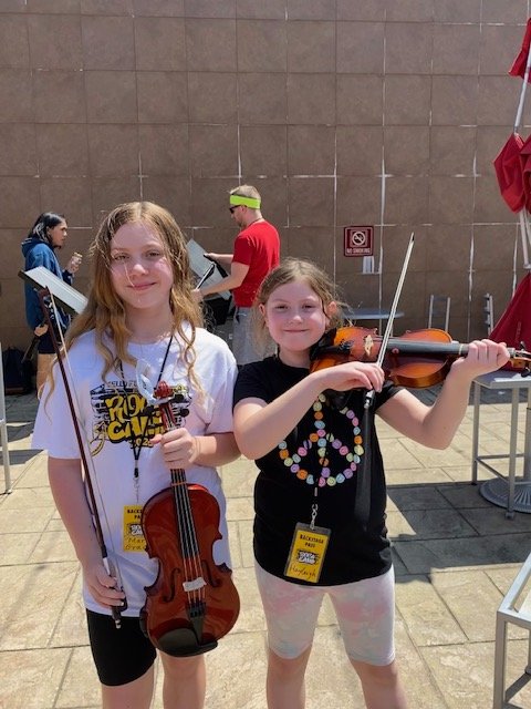 Mary Grace and Hayleigh Cello Fury Rock Camp Busking 7-13-23.jpeg