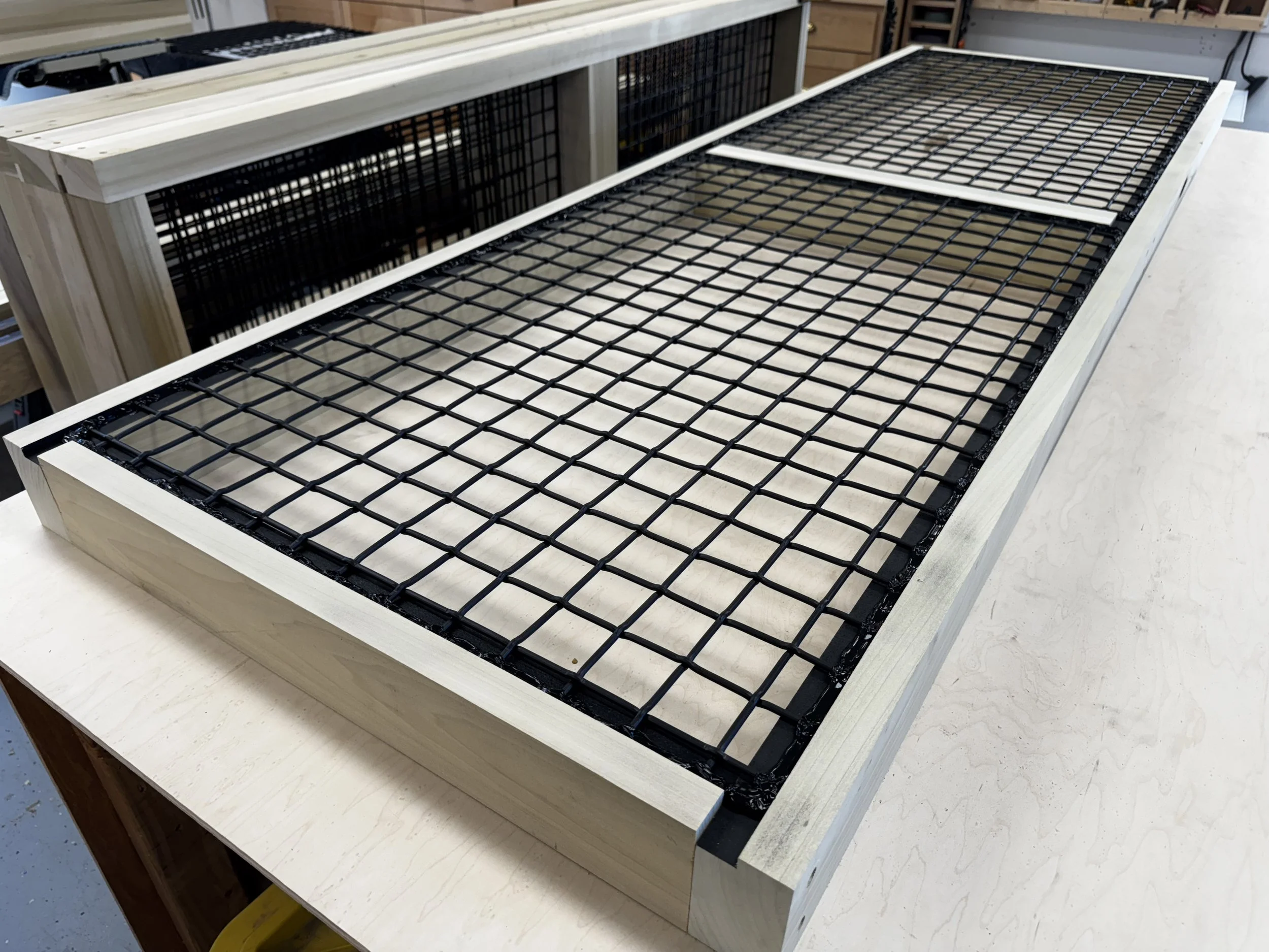 Custom interior catio with architectural mesh panels.