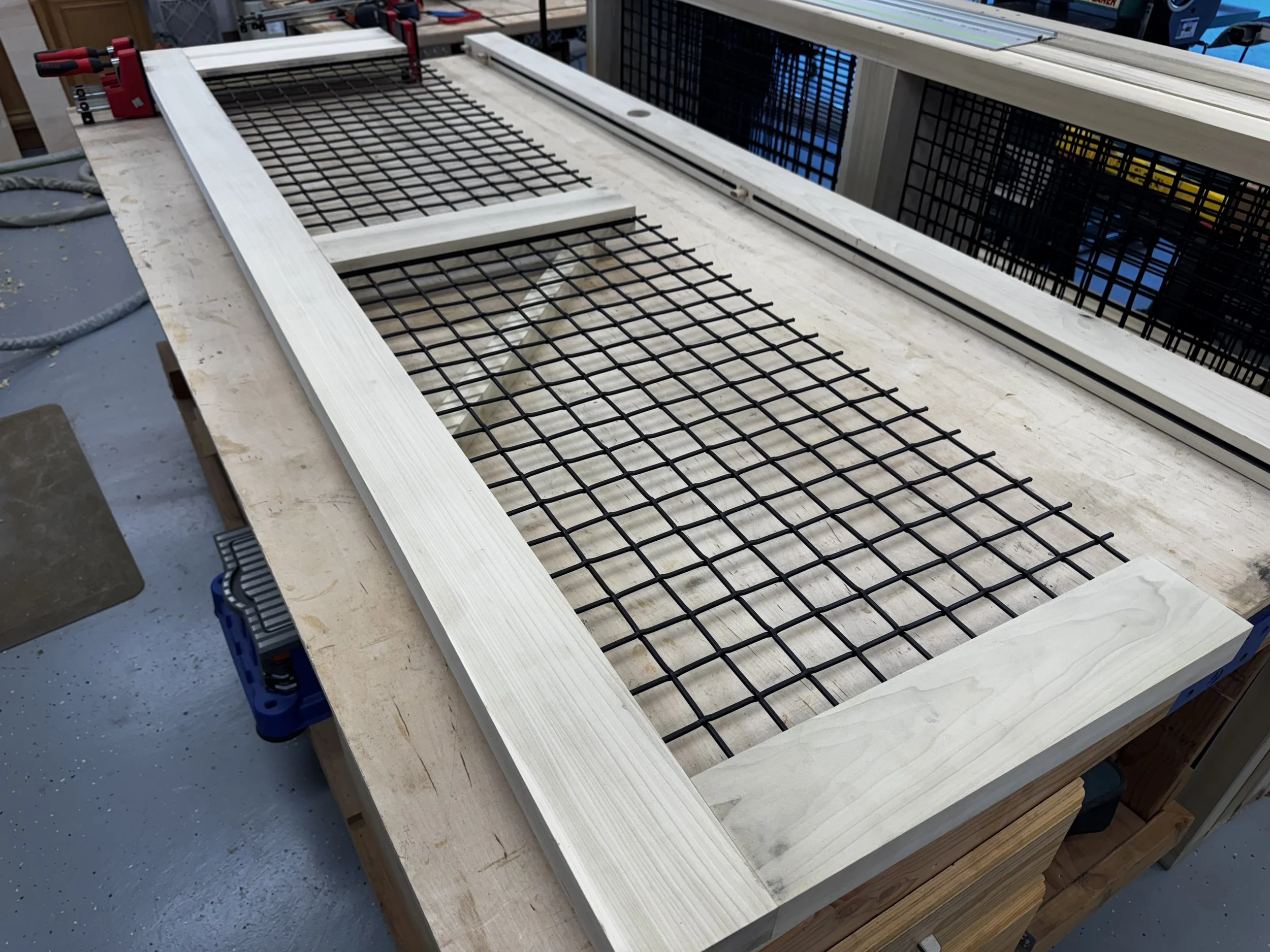 Custom interior catio with architectural mesh panels.