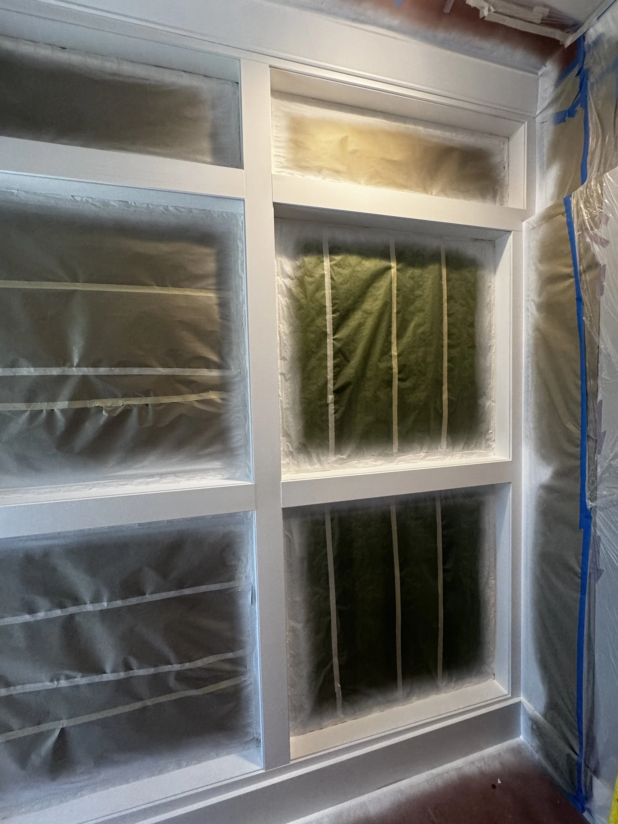 Custom interior catio with architectural mesh panels.