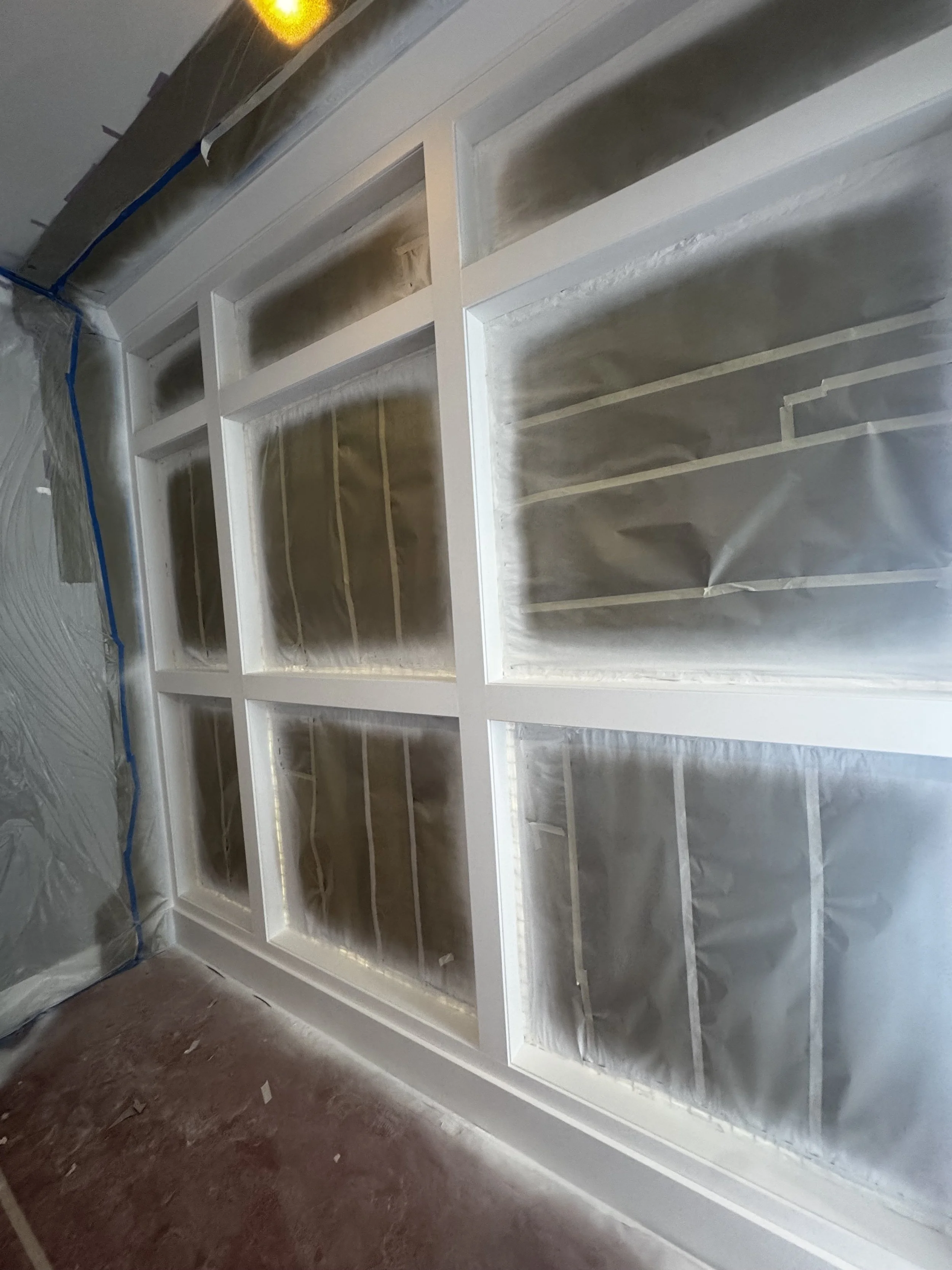 Custom interior catio with architectural mesh panels.