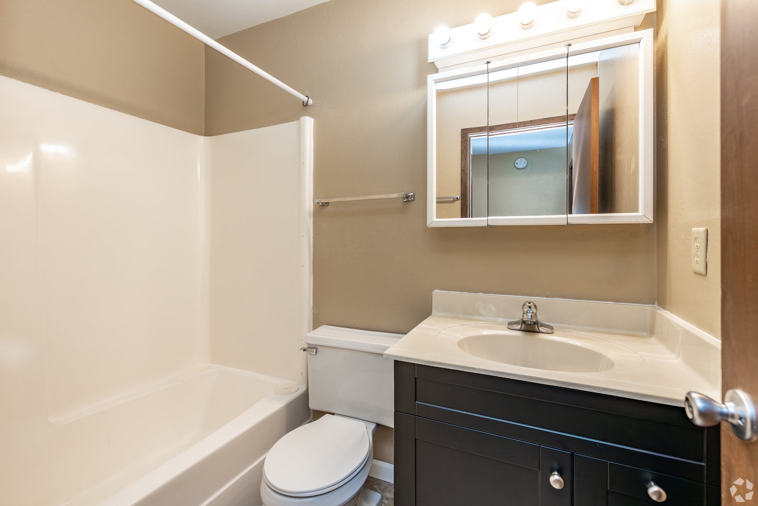 Clean bathroom and modern finishes at Raven Oaks Apartments