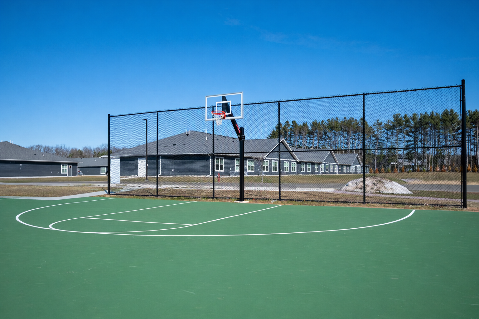 Prairie Hill Village offering townhome-style apartments in Baraboo, Wisconsin. Pet-friendly living including pickle ball and basketball courts and a gated dog park.