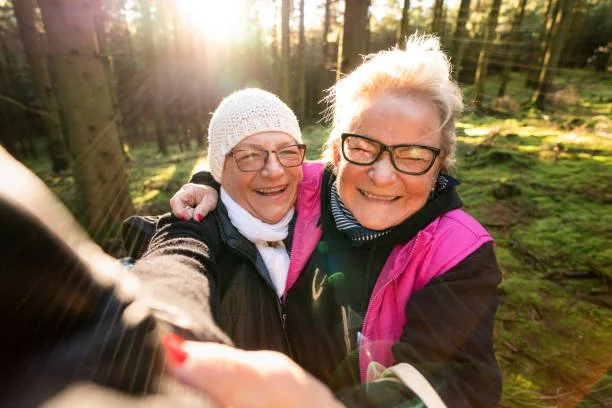 Two older adult women taking a selfie