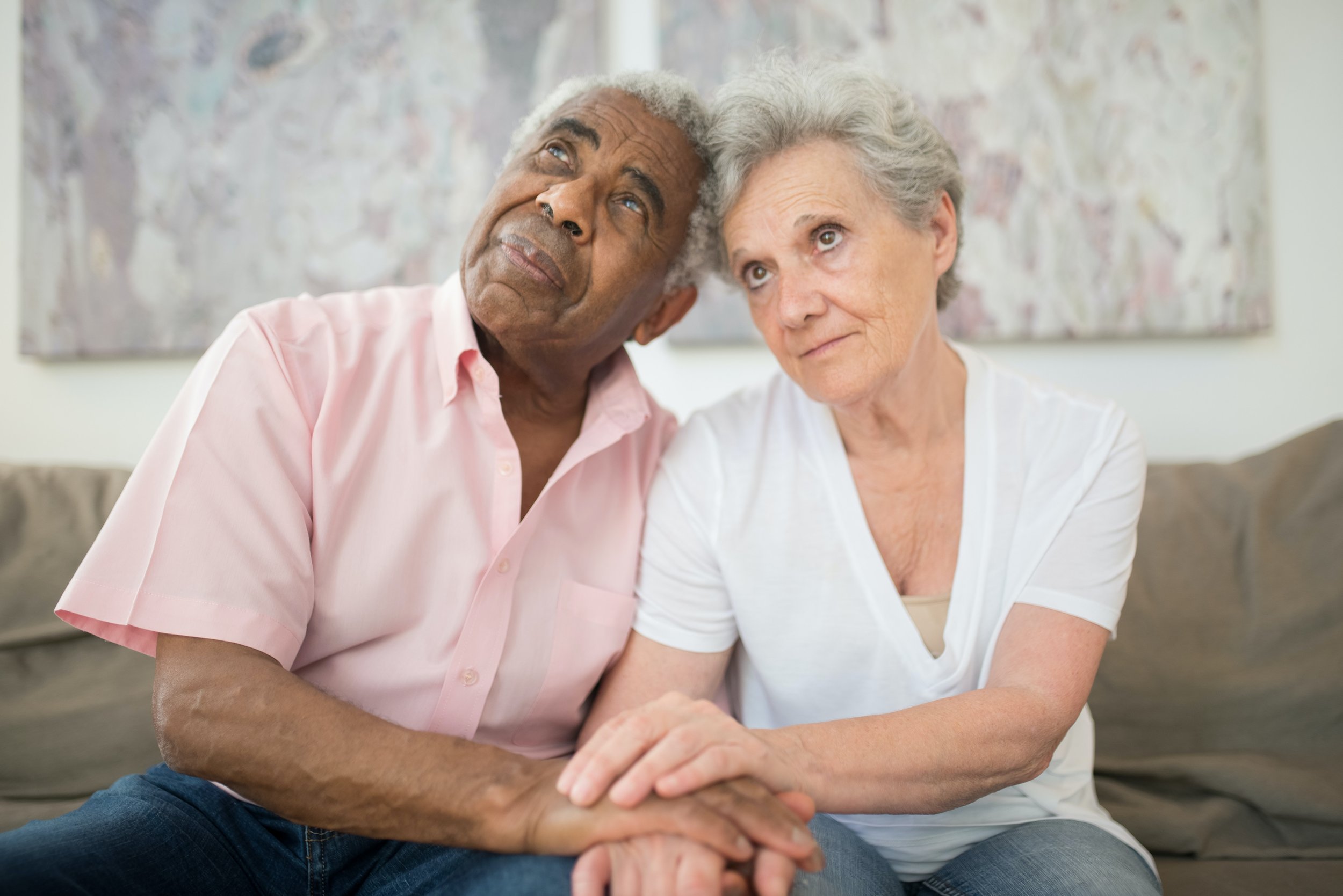 Older adult couple holding hands 