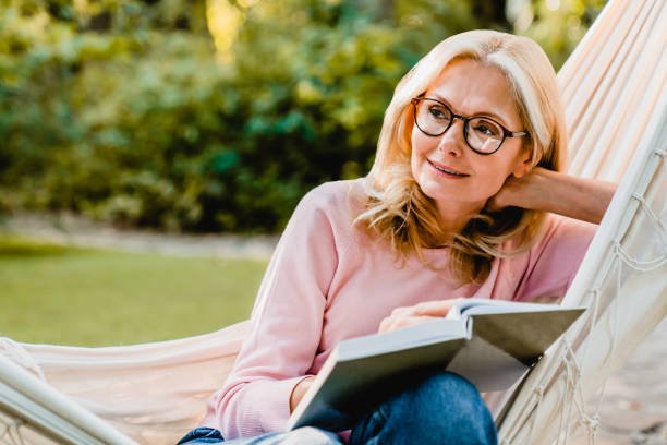 Middle aged women reading a book