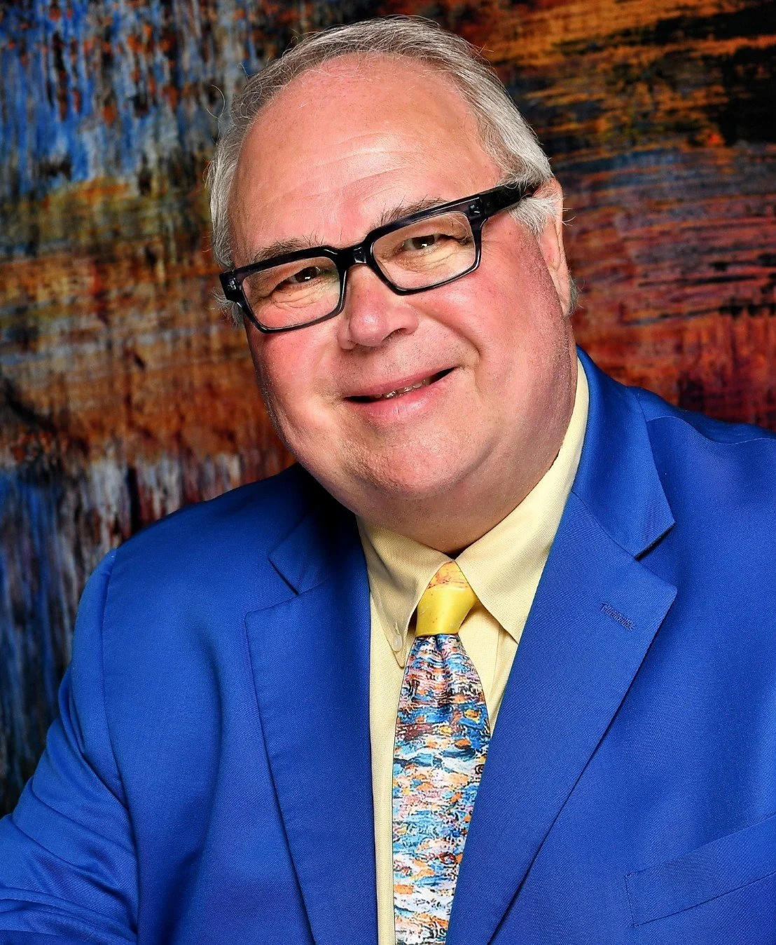 Headshot of Tim Hughes.