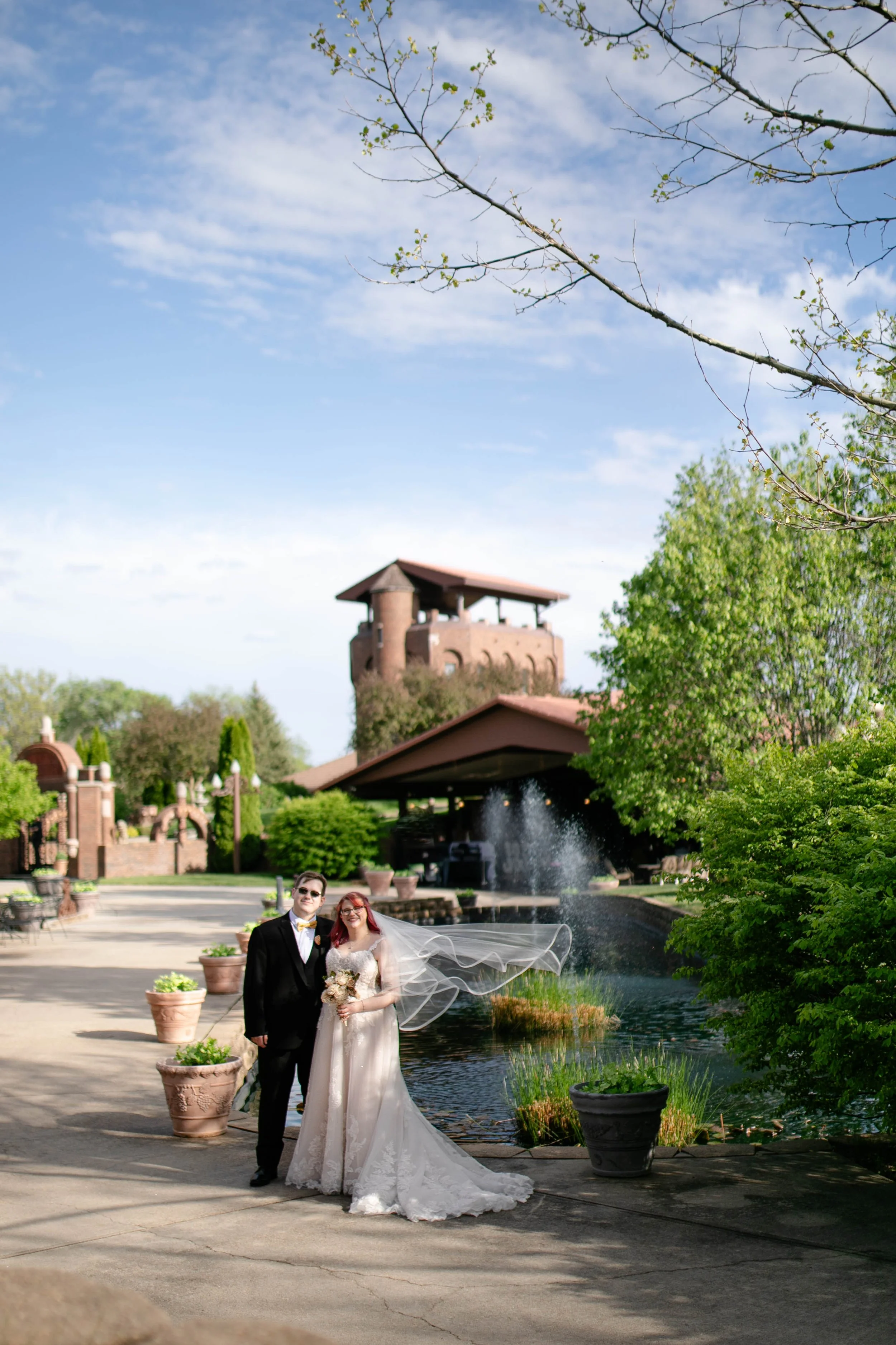 Bride and groom at Castle Unicorn venue in Iowa in springtime