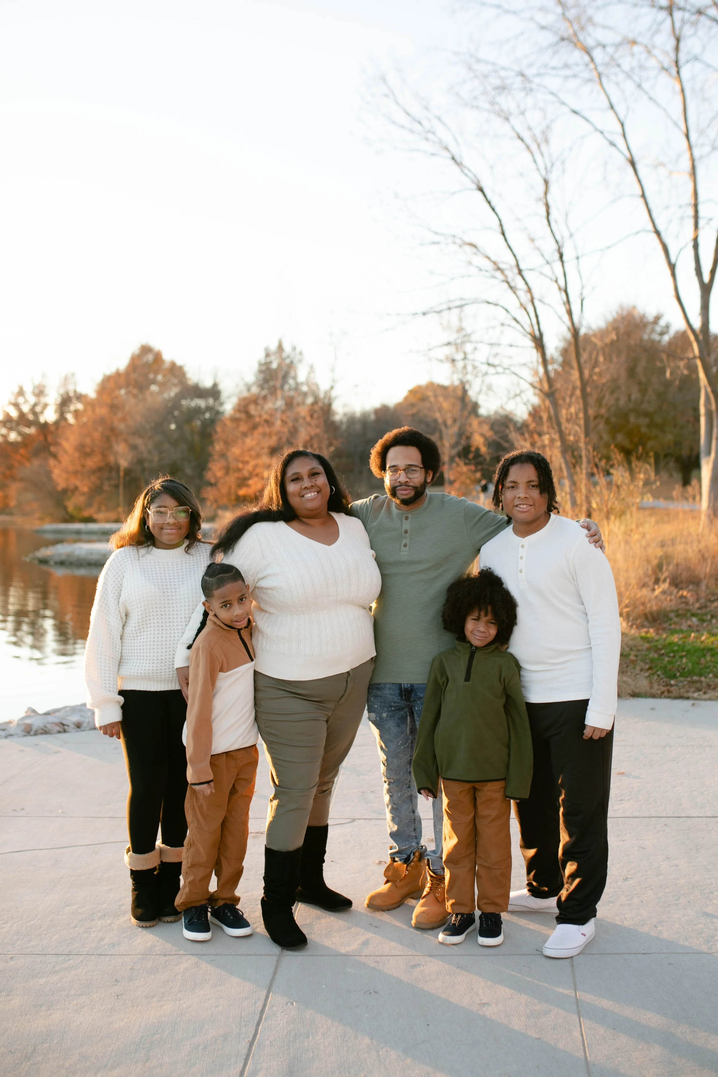 African American family smiling at camera in fall in Omaha Nebraska