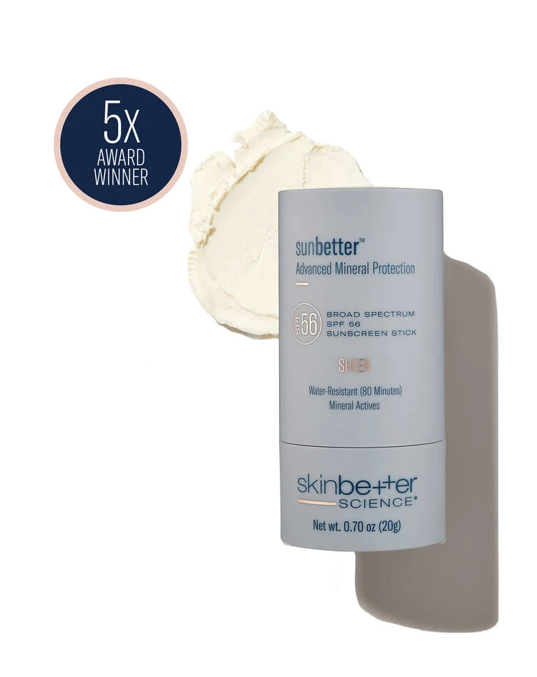A tube of Sunbetter Advanced Mineral Protection sunscreen stick with SPF 56, in a light blue container, beside a dollop of white cream or lotion. The label indicates broad spectrum, water-resistant for 80 minutes, with mineral actives, and is from Sk