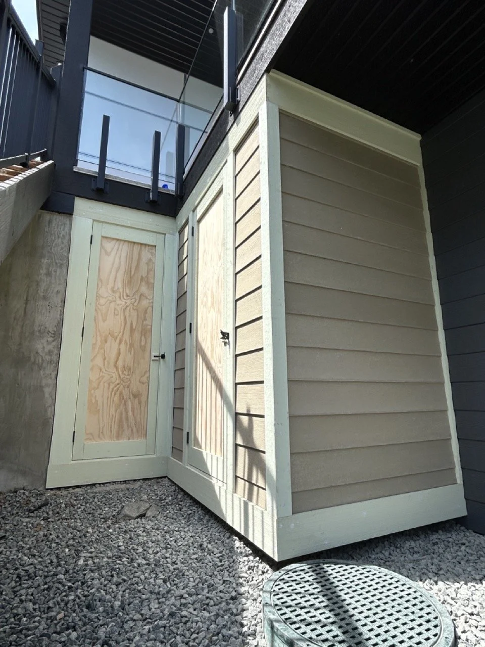 Under-deck storage shed, with Hardie-Plank siding.
