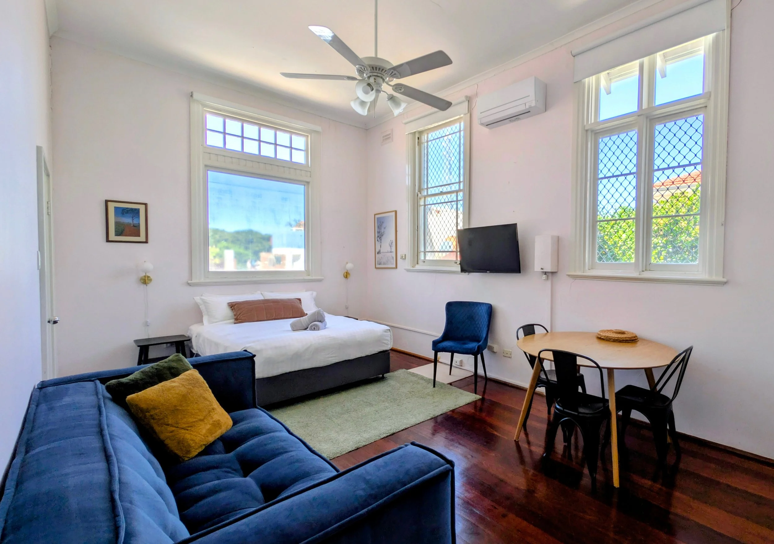 Private 2 bedroom apartment: bedroom 2 with smart TV, dining/work space & storage. 