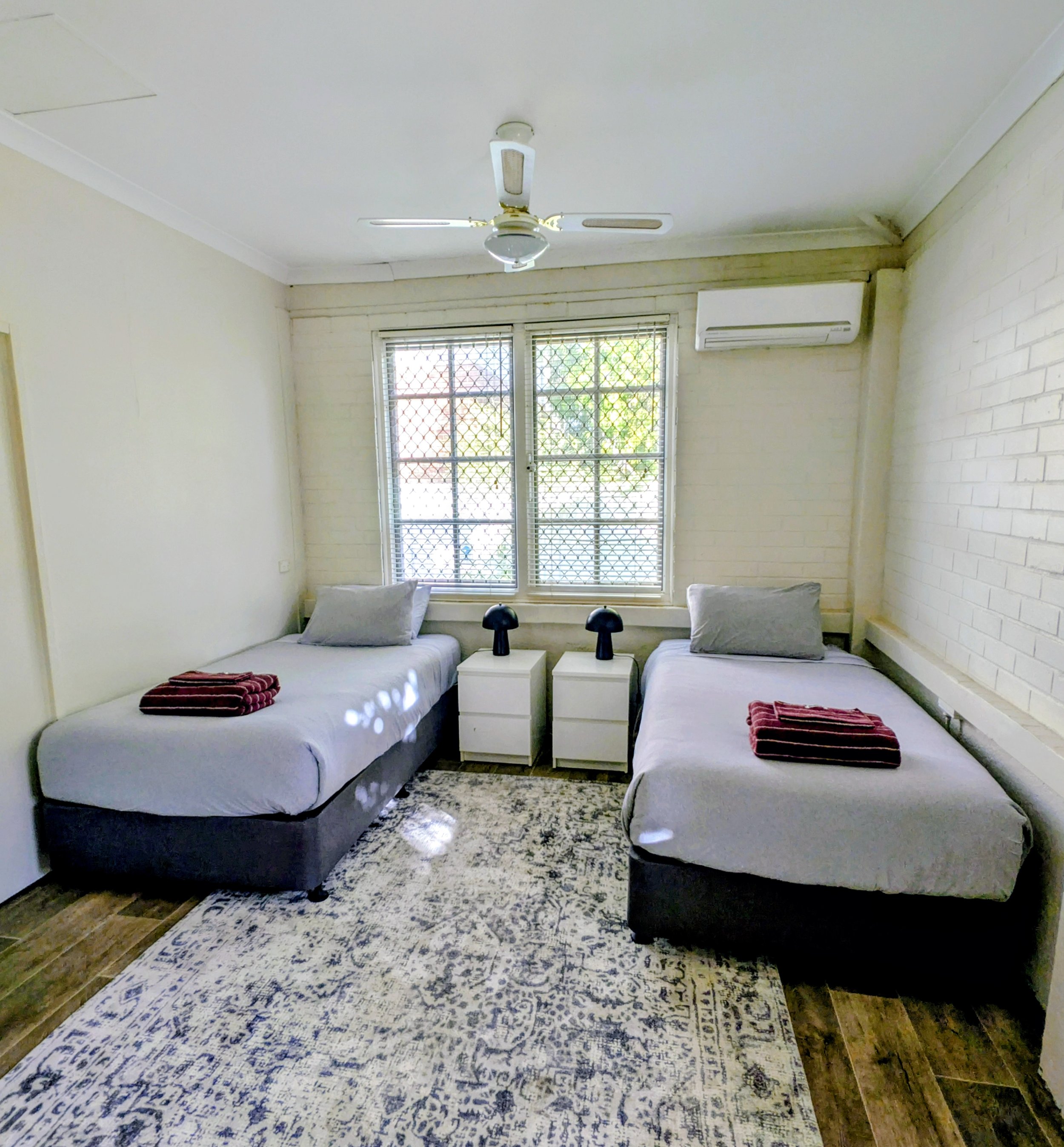 Heritage House: Suite 4 - 2 x king single beds, with smart TV, reverse cycle air conditioning & access to shared facilities.