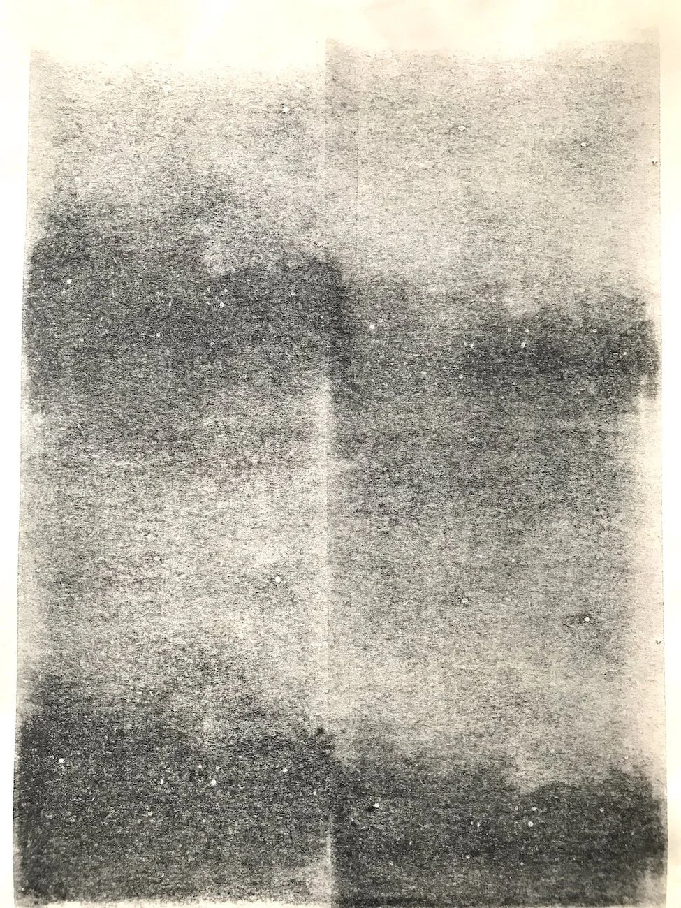 A sheet of newsprint with a night sky created with an inked roller by Julian Brasington