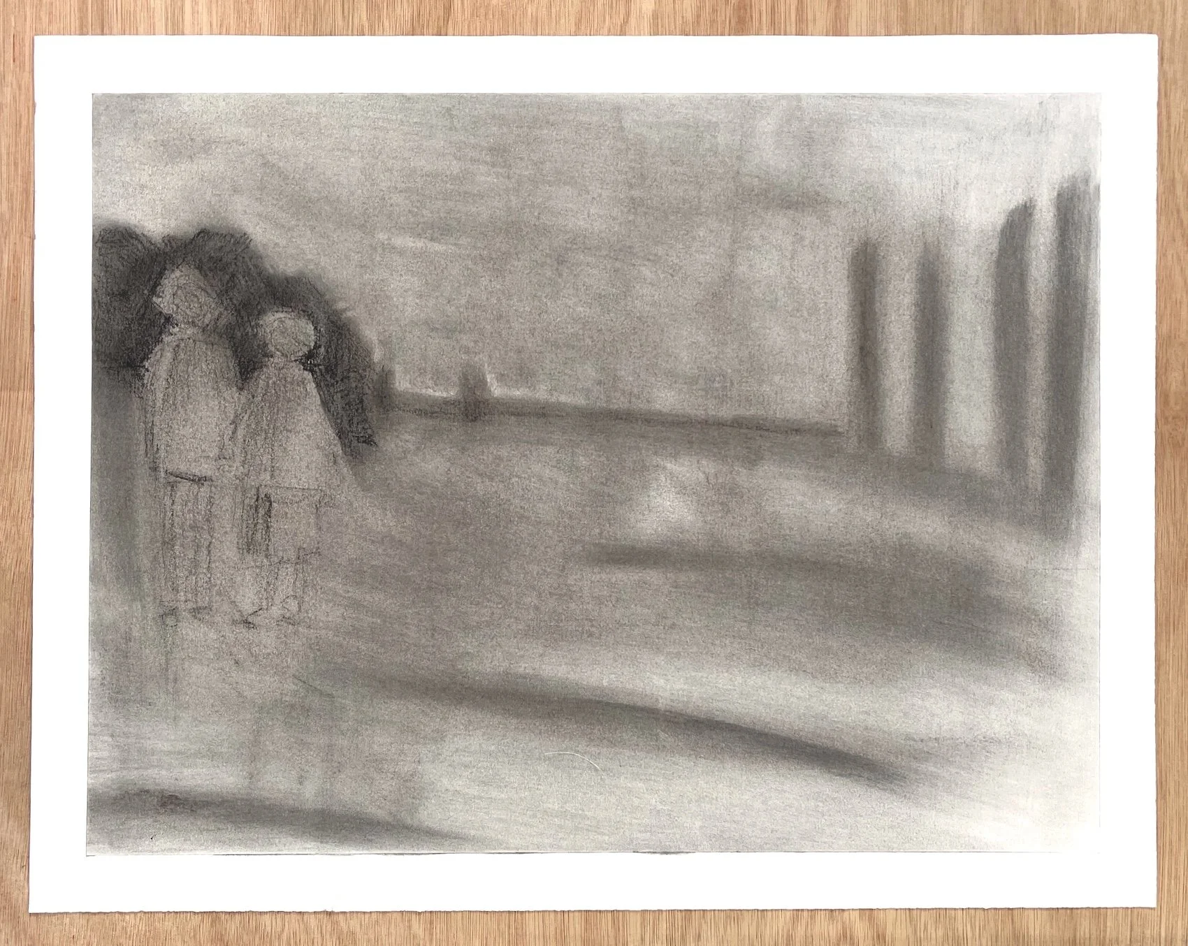 Full sheet view of a charcoal drawing depicting two figures in an open atmospheric landscape, with visible paper edges.