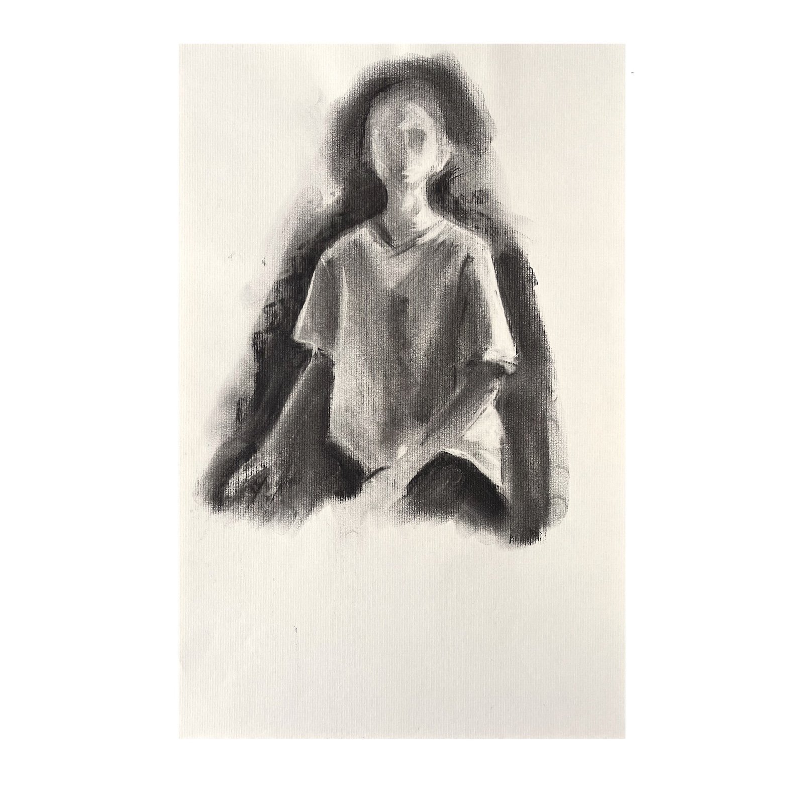 Suspended, charcoal drawing of a seated figure emerging from dark charcoal tones, with the lower portion of the paper left blank.