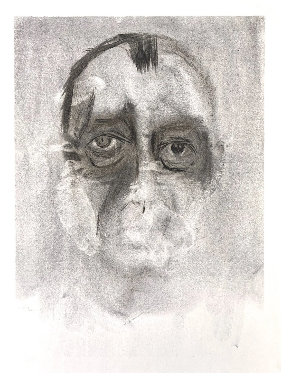 Portrait in charcoal of a man's face by Julian Brasington.