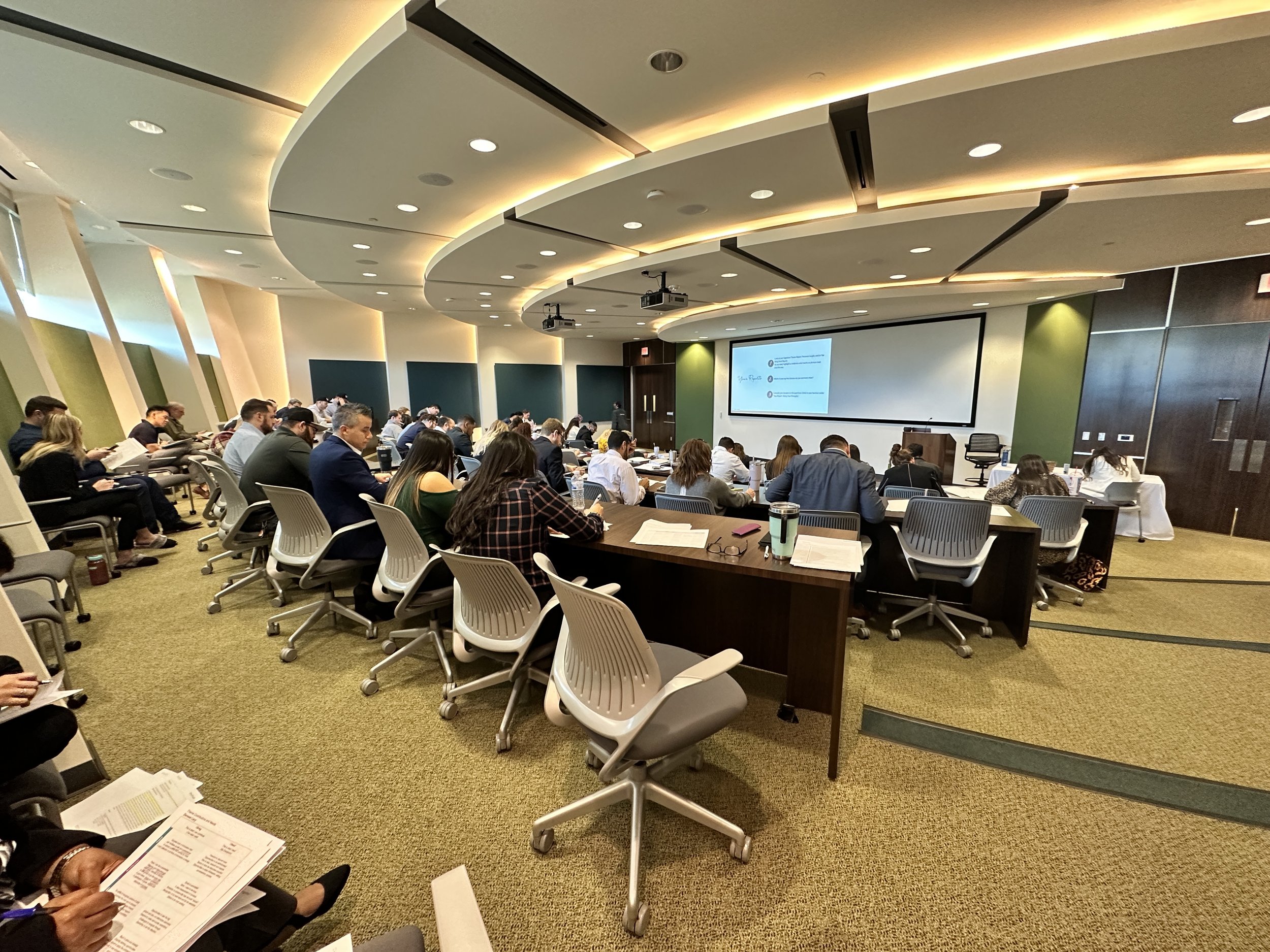 pic of people working in a tiered training room
