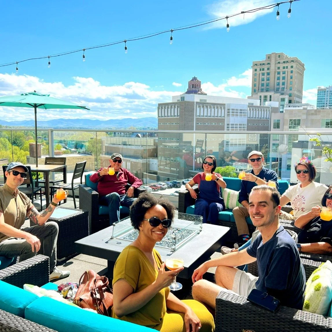 Who says you have to leave town to feel like you&rsquo;re on vacation this holiday weekend? 🌅🍹

When you step onto a rooftop overlooking downtown Asheville with a summer cocktail in hand, mountain sunsets in the distance, and live city energy all a