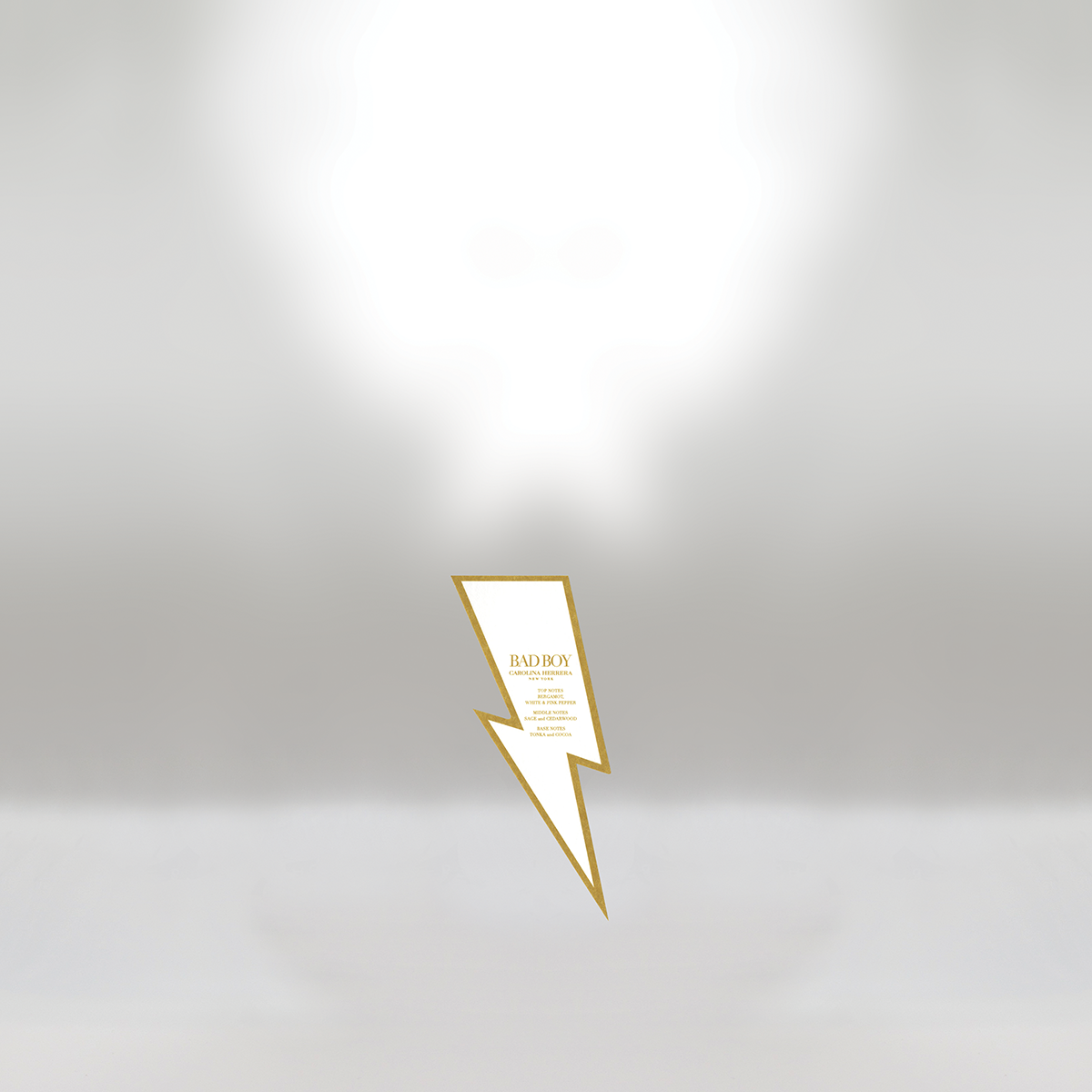 A white background with a gold-bordered lightning bolt-shaped card in the center, displaying the text 'BAD BOY CAROLINA HERRERA' along with additional details and a list of notes.