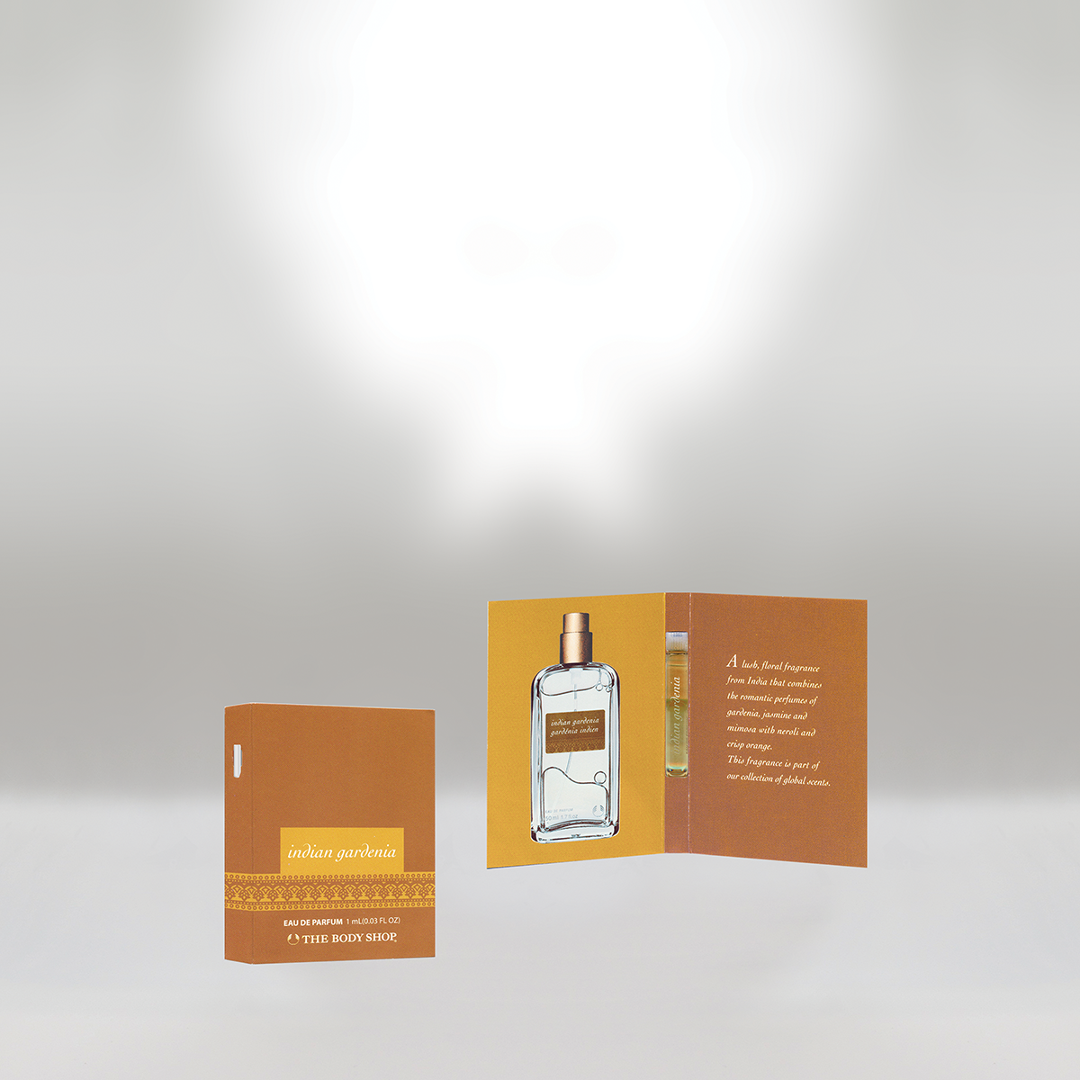Open perfume sample card for Indian Gardenia by The Body Shop, showing a small perfume bottle, product description, and packaging.