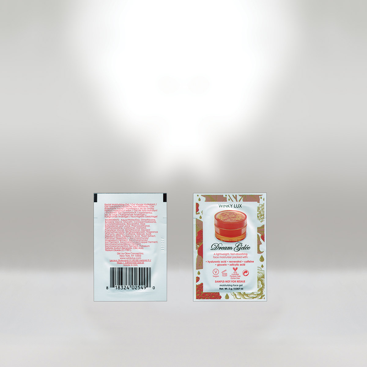 Packaging of WINKY LUX Dream Gelée face moisturizer in a small container with gold accents, featuring a botanical design on the label, and a barcode on the back.