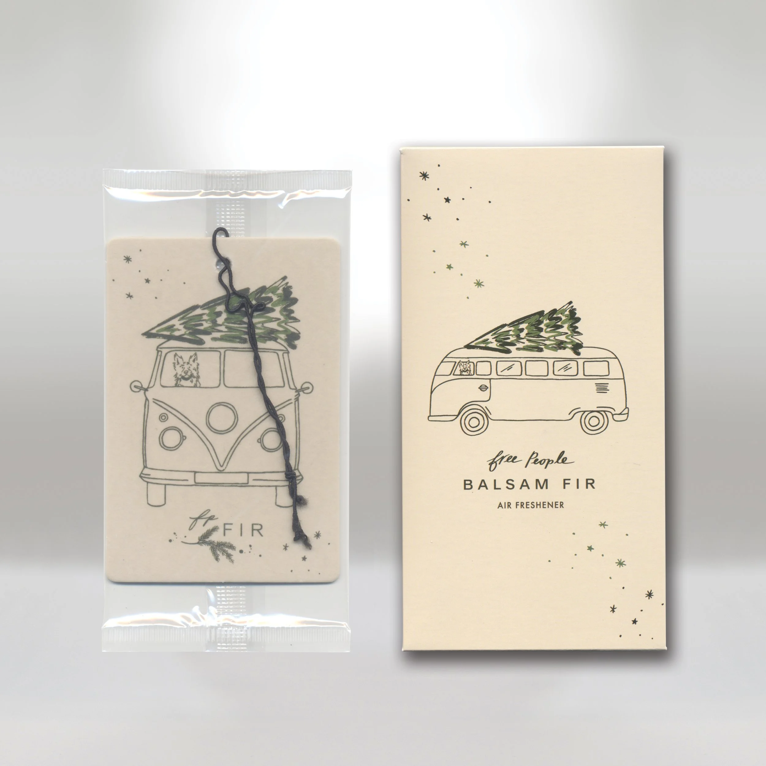 Air freshener in packaging depicting a line drawing of a vintage van with a pine tree on top, accompanied by star and circle patterns, labeled 'free people BALSAM FIR'.