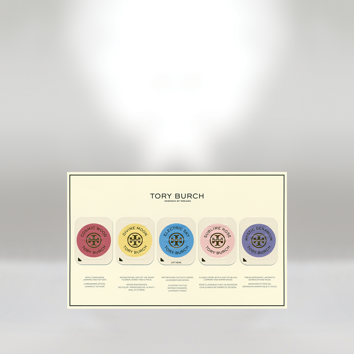 Tory Burch perfume sample set featuring five scents: Cosmic Wood, Divine Moon, Electric Sky, Sublime Rose, and Mystic Geranium, each in a small round container with a branded label and description below.