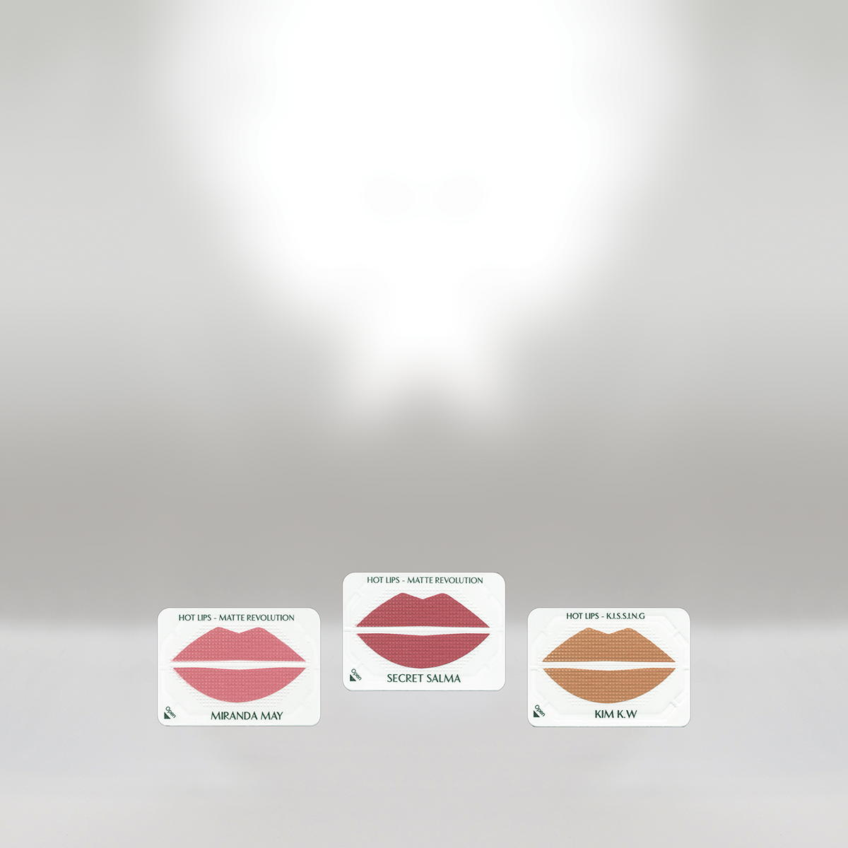 Three cards labeled 'Hot Lips - Matte Revolution,' featuring stylized lips and names 'Miranda May,' 'Secret Salma,' and 'Kim K.W.' arranged on a white surface.