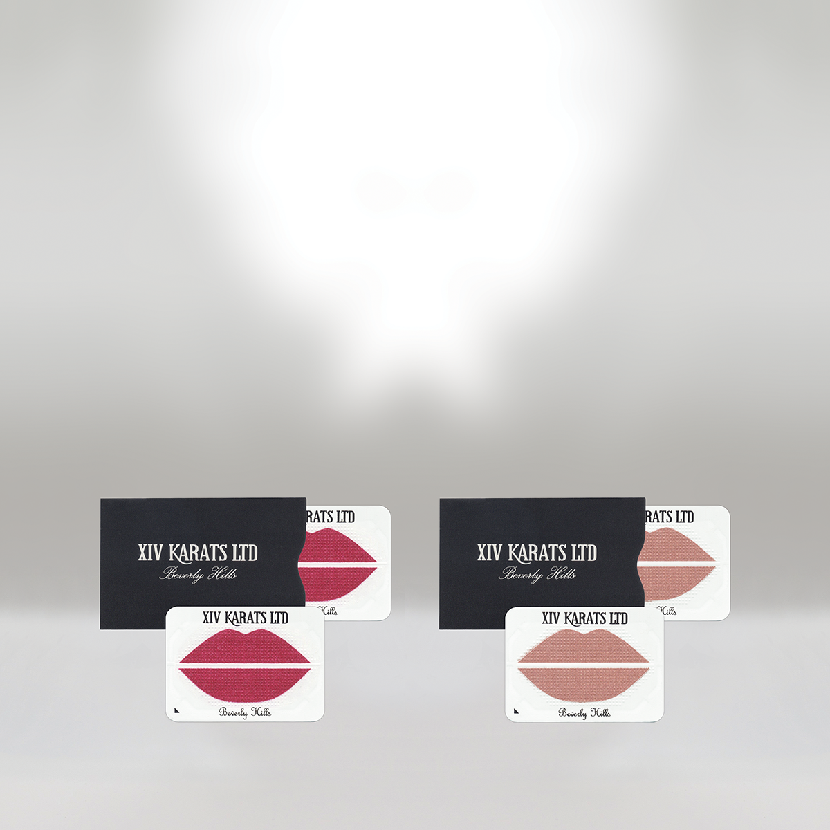 Four cards with lipstick kiss marks, two with red and two with nude shades, labeled 'XIV KARATS LTD Beverly Hills' and black or white backgrounds.