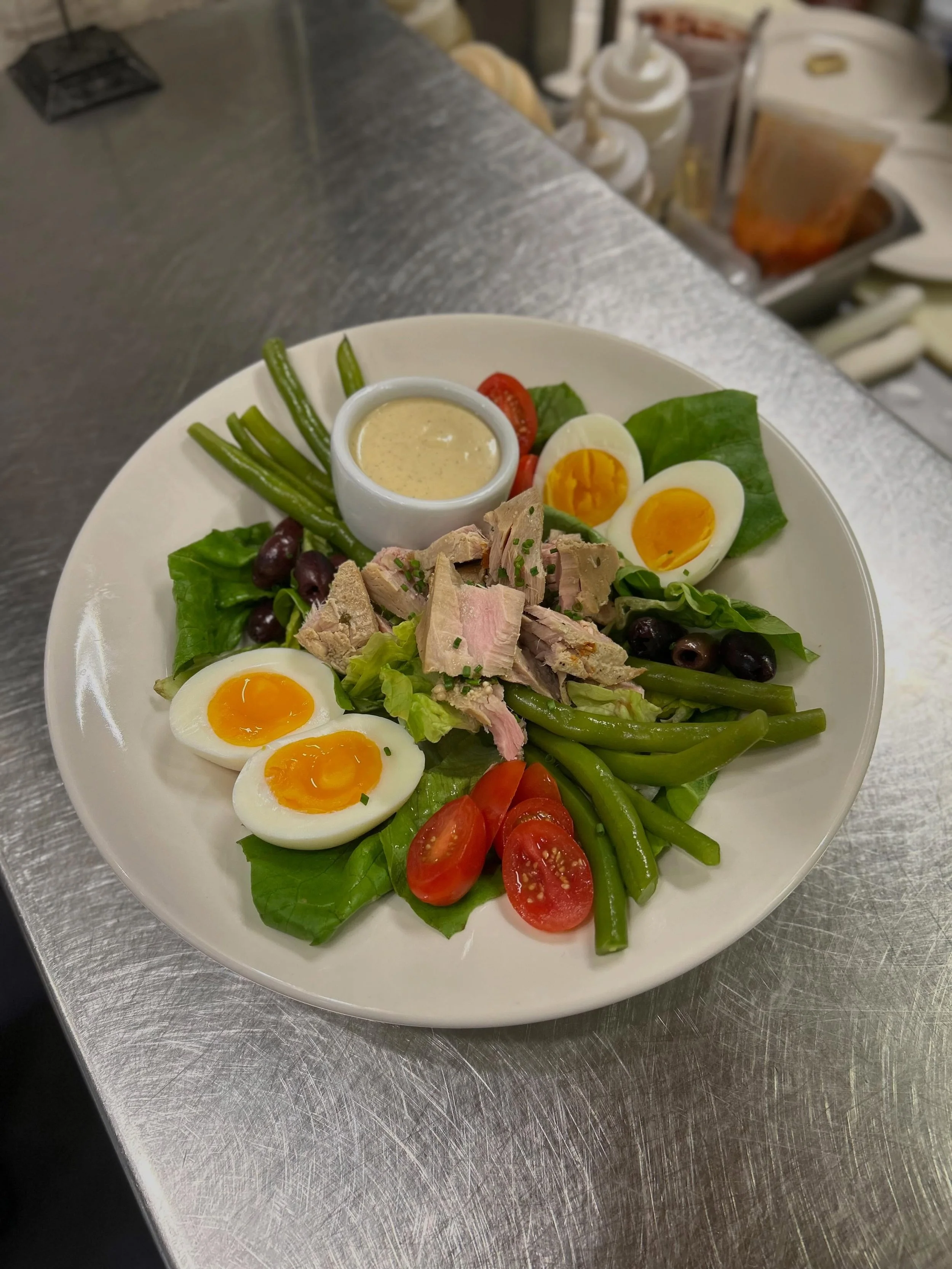 some of our current specials 🐟 on through 6/18!

the BERNICE Ni&ccedil;oise salad - tuna poached gently in olive oil with herbs and garlic, jammy eggs, string beans, kalamata olives, cherry tomatoes, on a bed of little gem lettuce from @plowbreakfar