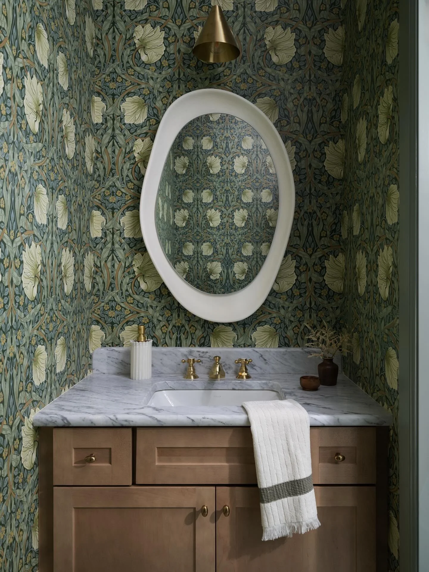 Let&rsquo;s talk Powder Rooms! The best place to go bold and debatably one of my favorite spaces to design. We used the most fun wallpaper, lighting and mirror at our Crescent Lake project. Let&rsquo;s also not overlook the full bullnose edge on the 