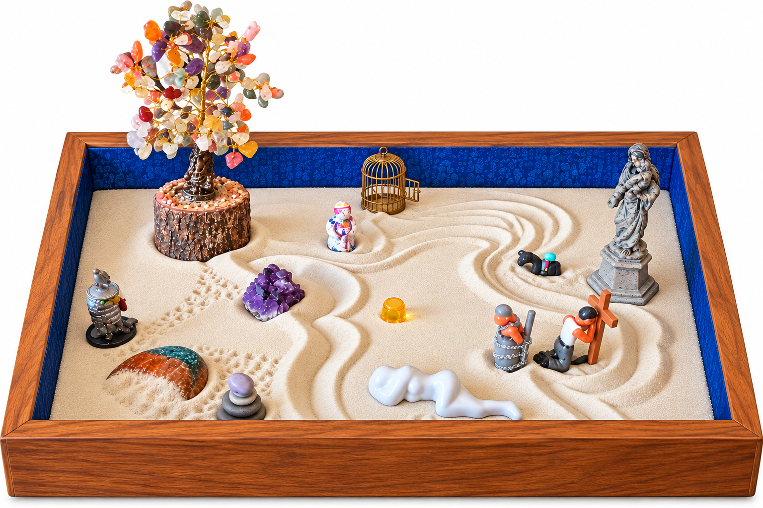 A miniature diorama of a sand landscape with various small figurines and decorative objects inside a wooden box with blue lining.