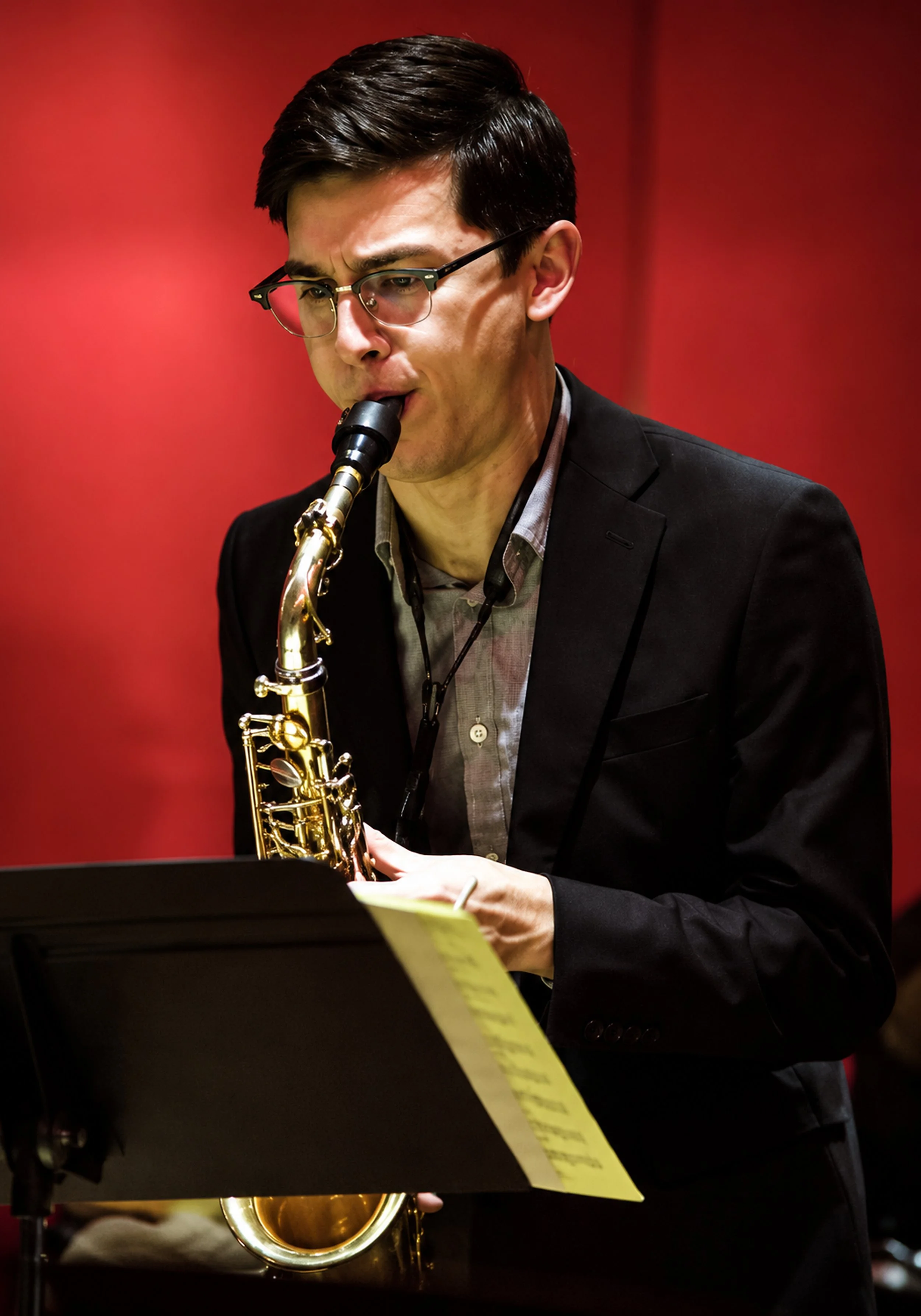 14_Focused_Saxophonist_Against_Red_Backdrop_1__highres.jpg
