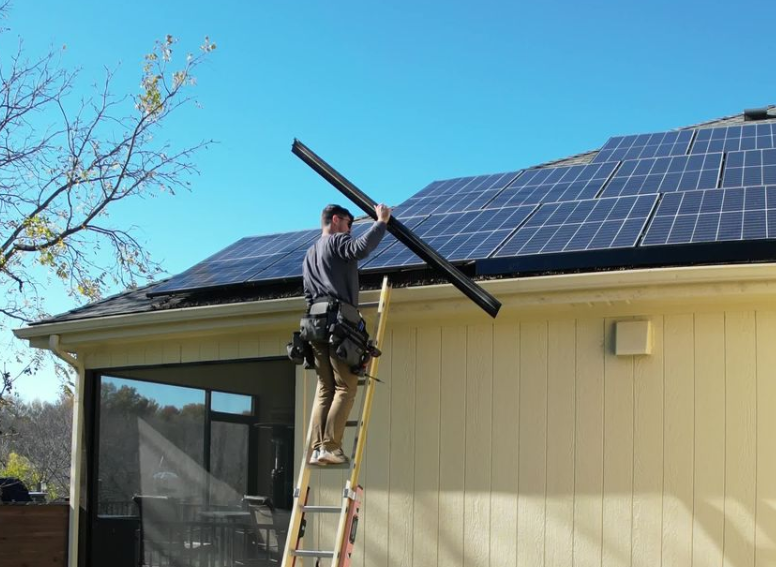Solar Scapes installing animal guard on a home.