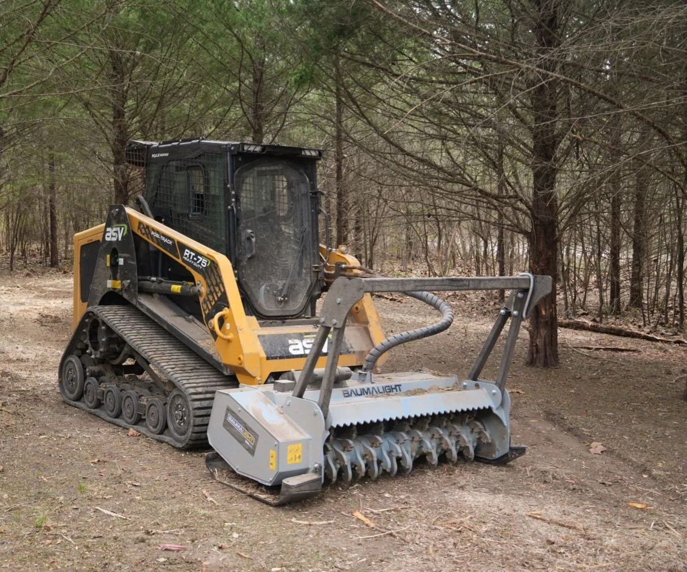 An earthworks machine clearing out land.
